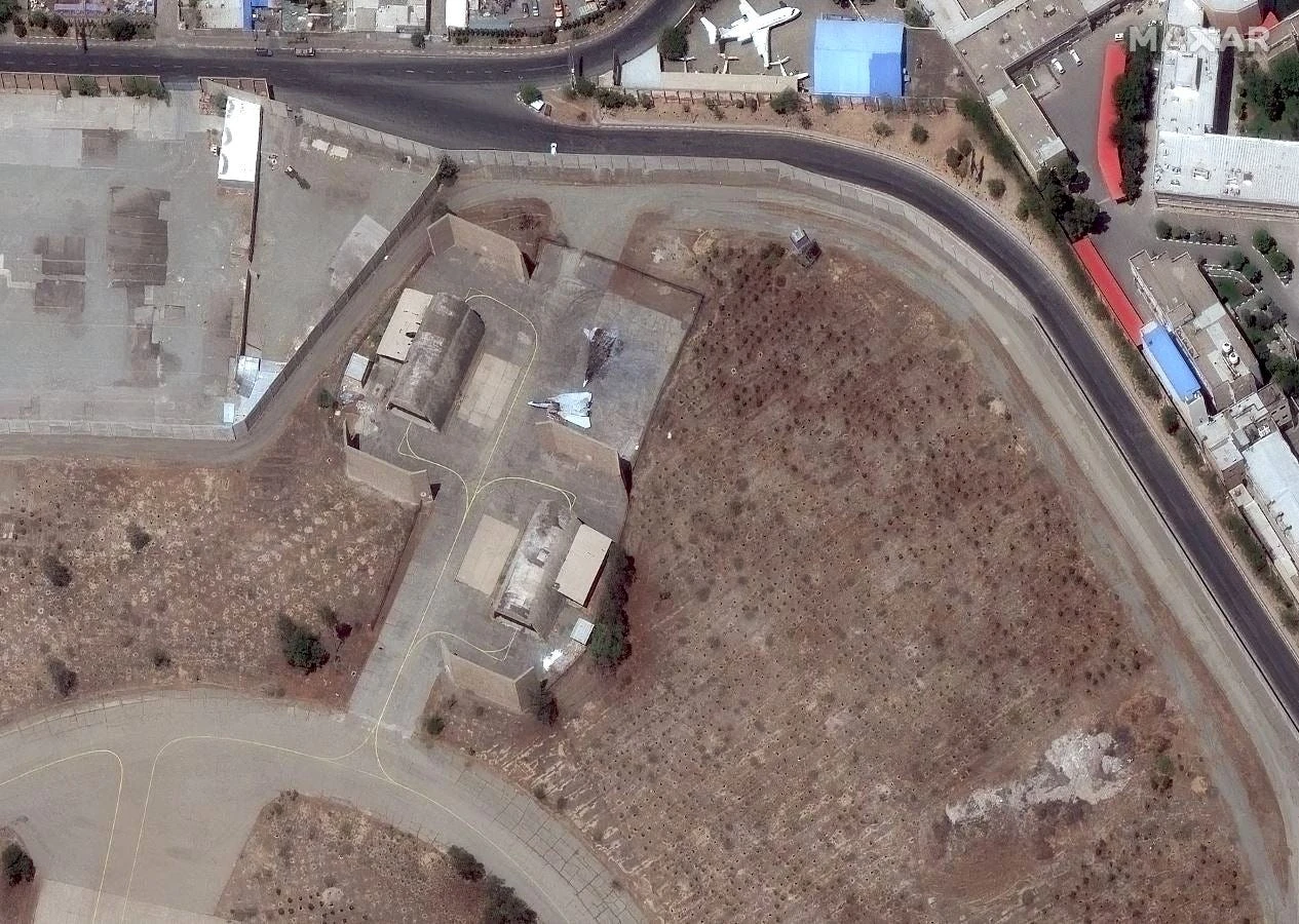 Satellite image of an Iranian airport shows an American-made F-14 Tomcat that Israel turned into a burned wreck