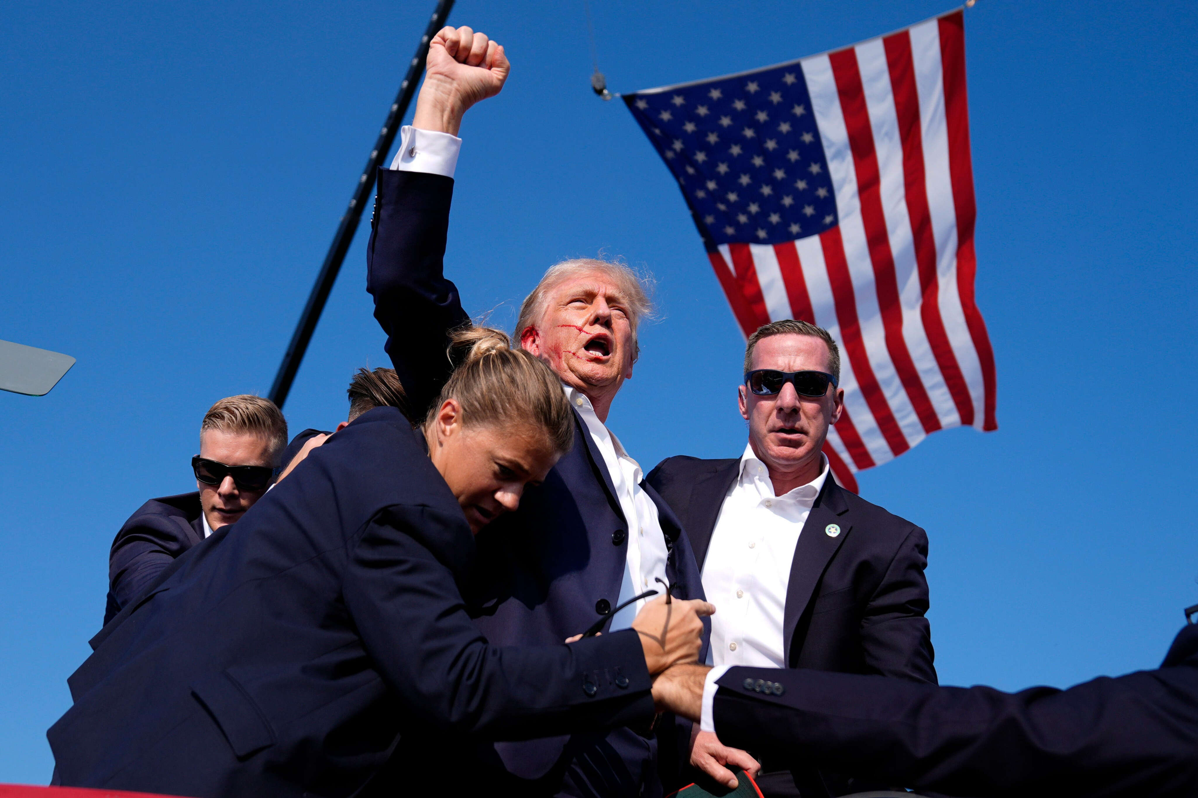 A photo of a bloodied Trump raising his fist after being shot is already becoming a Republican rallying call