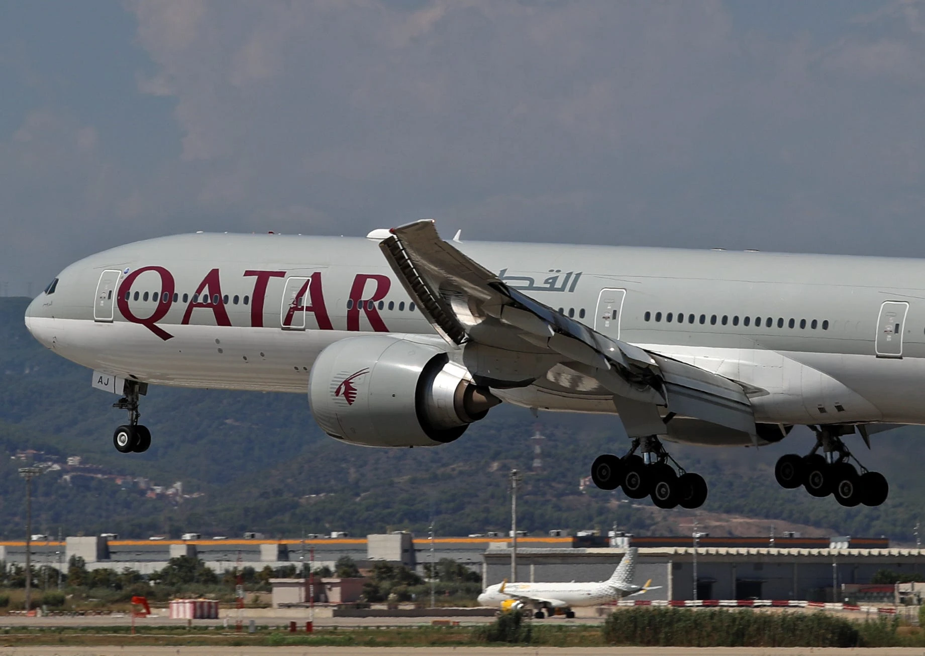 The family of a Qatar Airways passenger who died after choking during his flight is suing the airline
