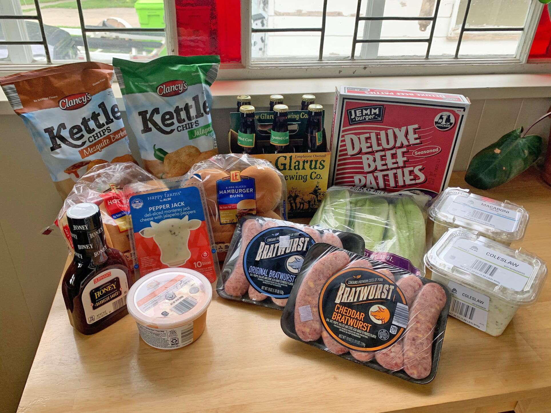 I spent $50 at Aldi to host a barbecue for 4 people. My budget got us plenty of meat and sides, plus a case of beer. 