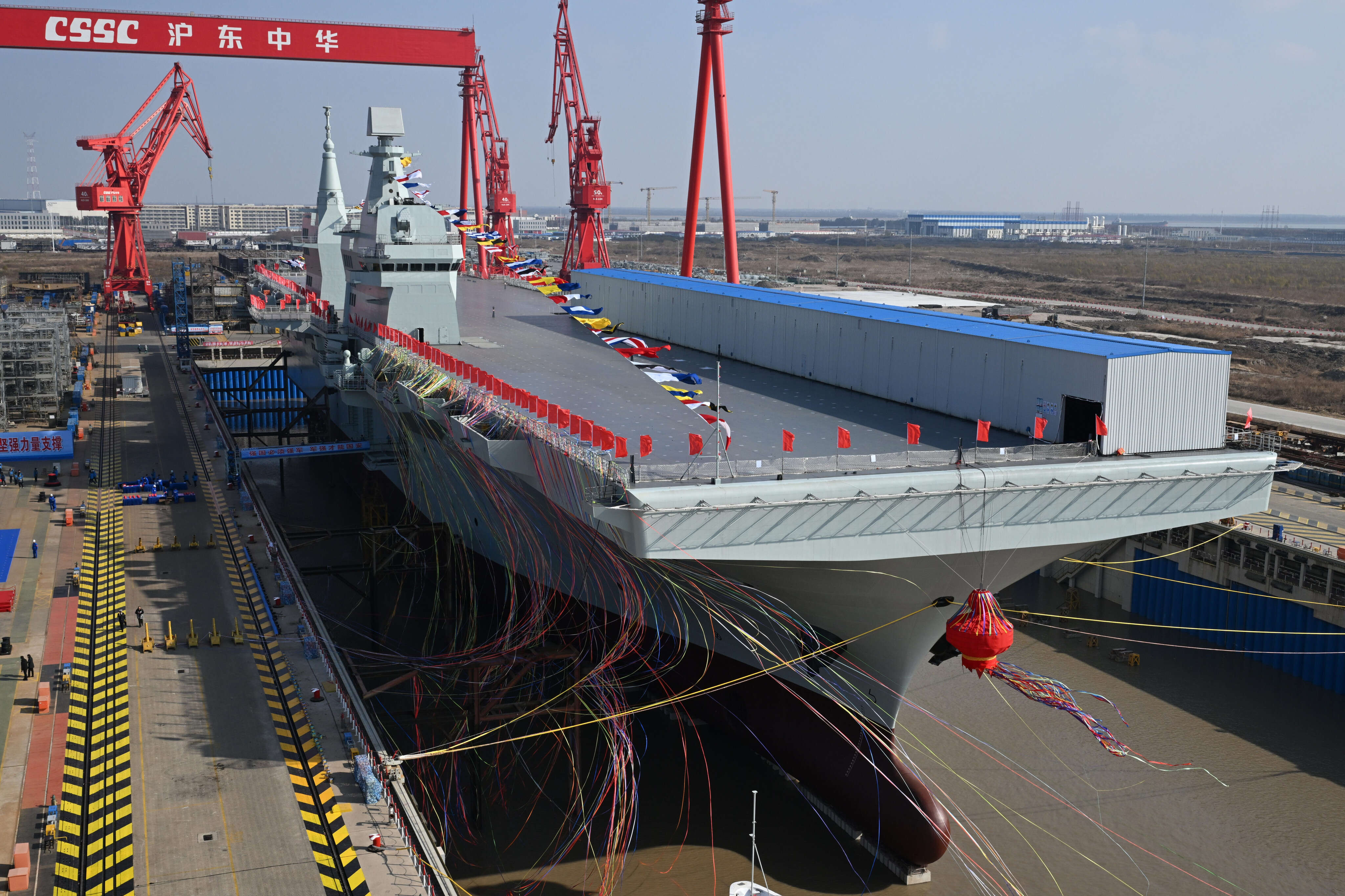 See aboard China's new massive assault ship that can launch fighter jets or drones