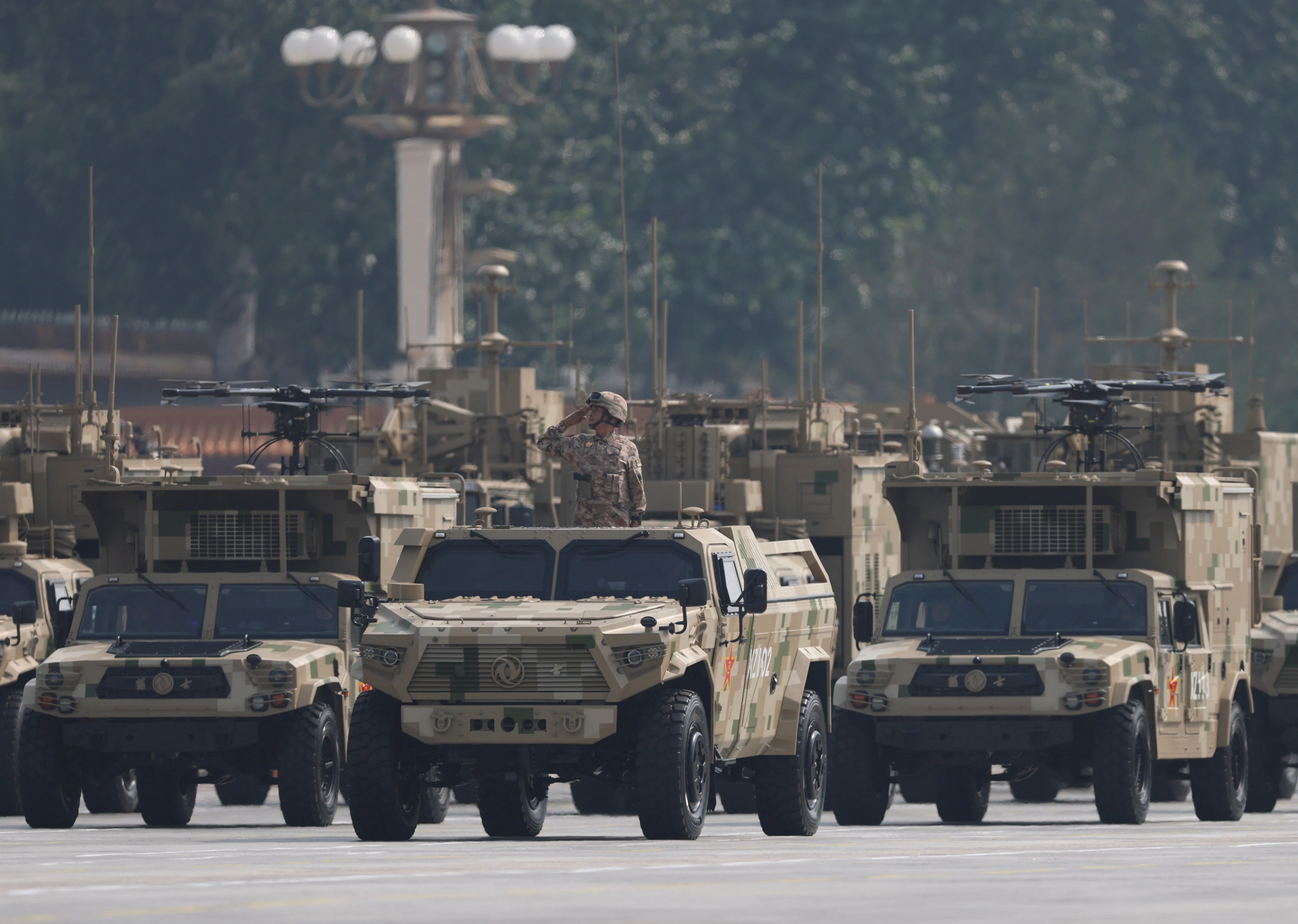 China's big weapons flex in Beijing shows it's gearing up for an uncrewed and electronic warfare fight, but that's not all