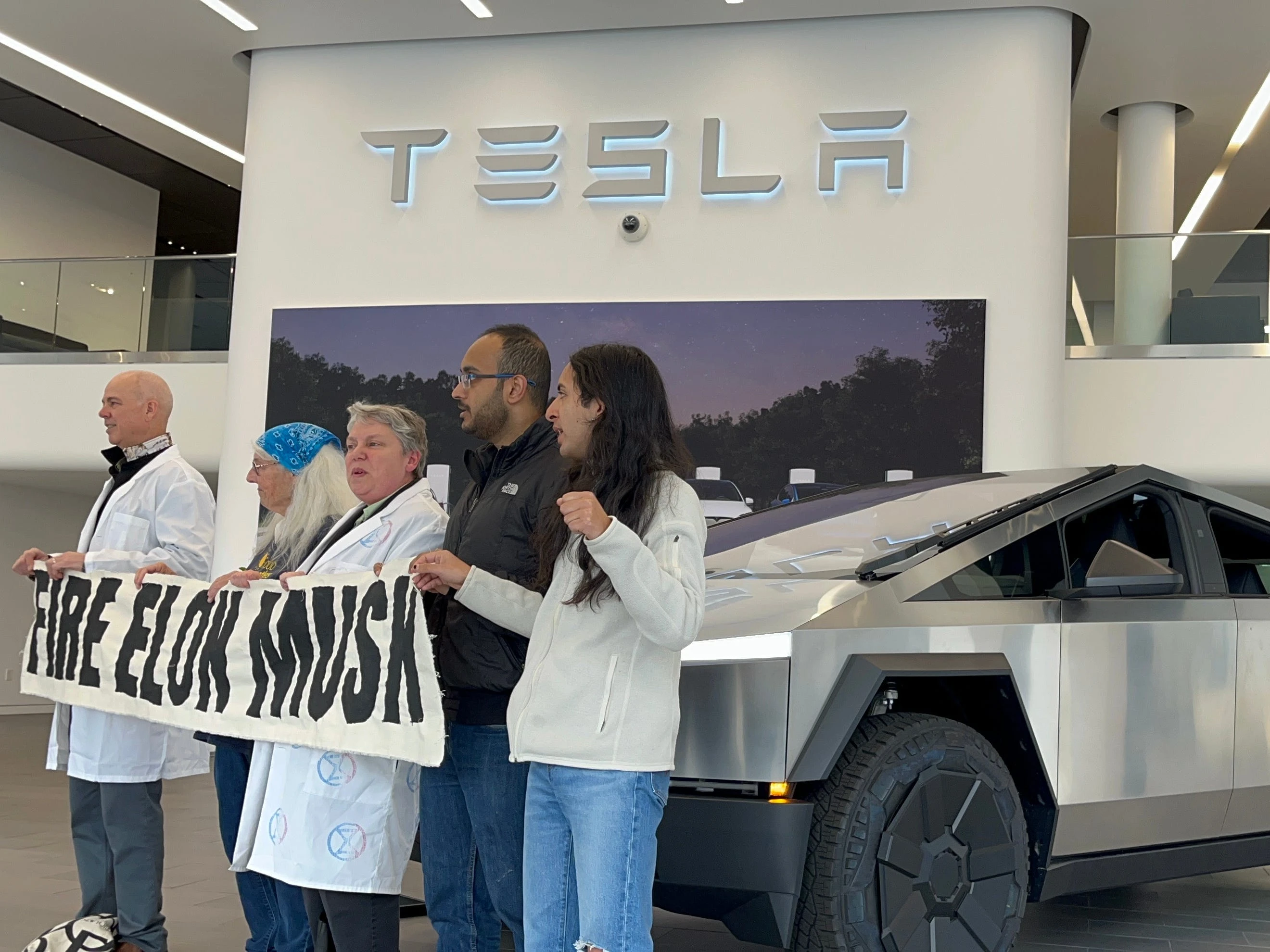Protesters are taking a victory lap after Tesla's dismal earnings — and taking aim at Musk's other companies 