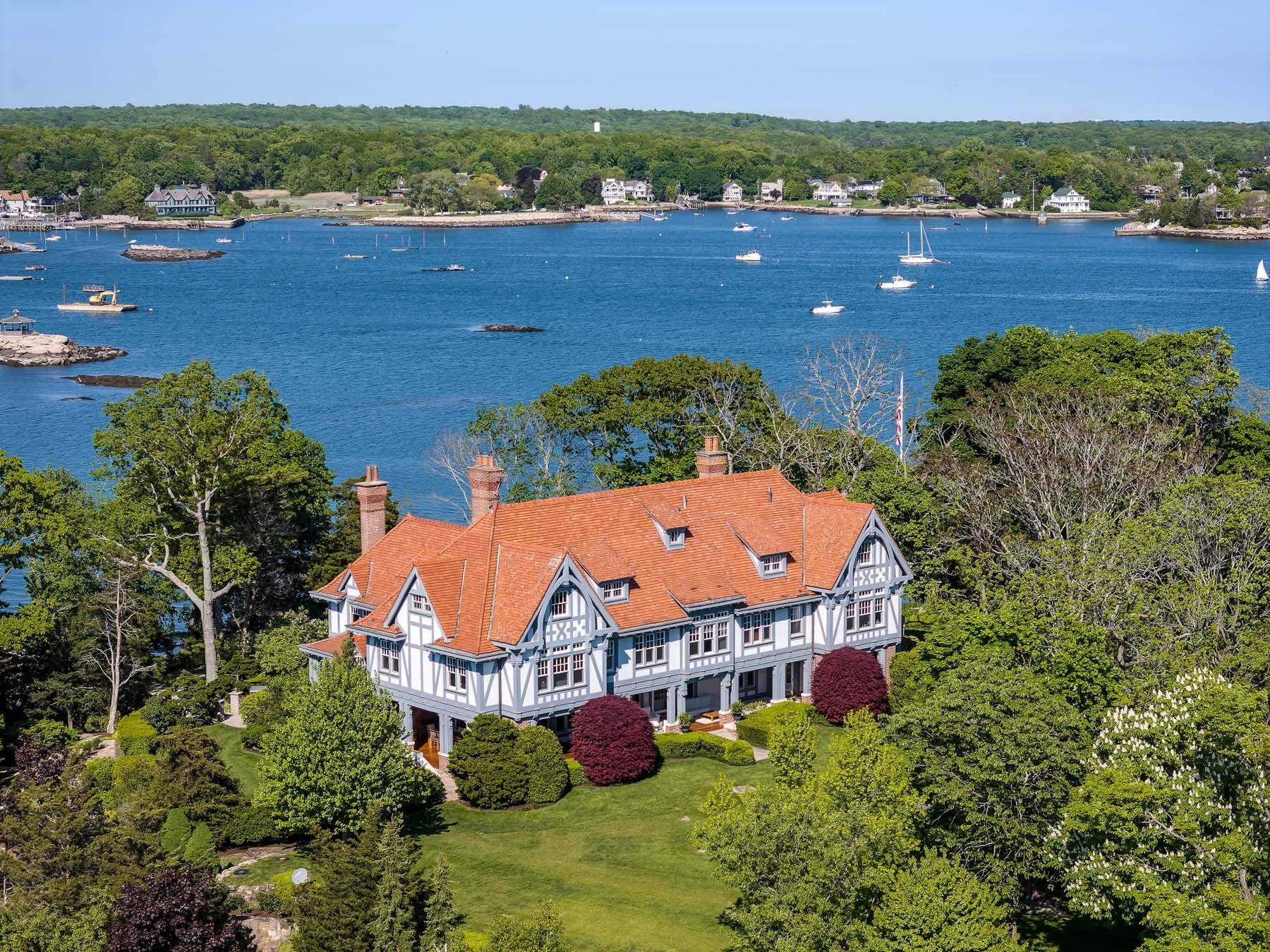 A Bridgewater exec is still trying to sell his private island. He cut its price — and threw in a mainland house with a dock.