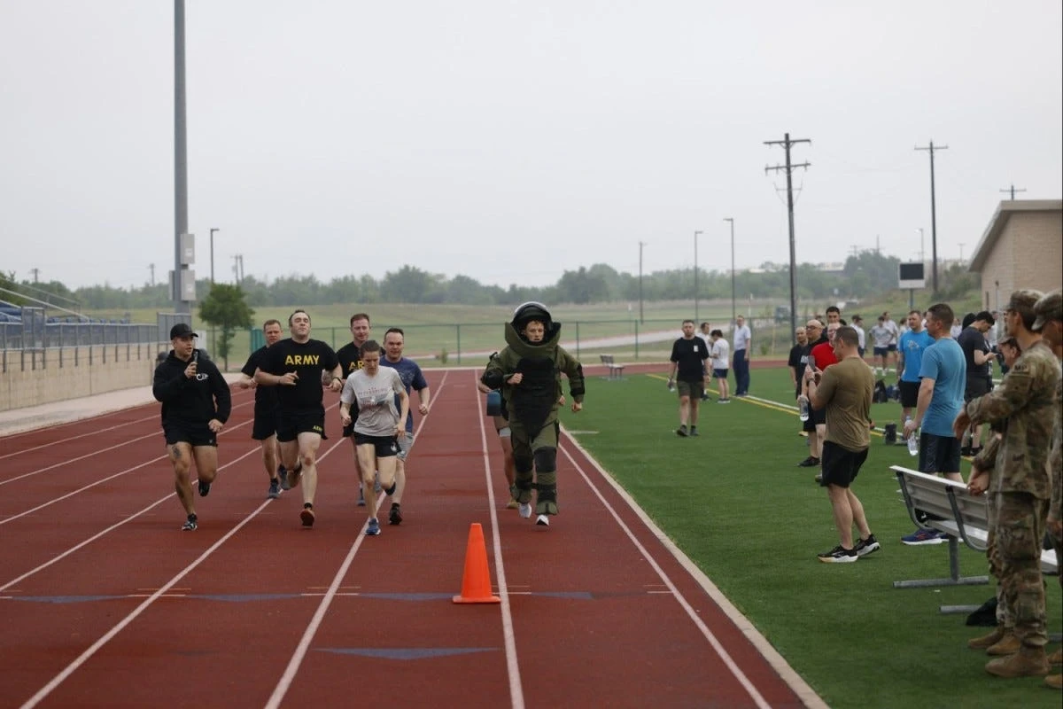 A US Army officer who handles explosives broke the world record for the mile run in a bomb suit. He was 20 seconds faster.