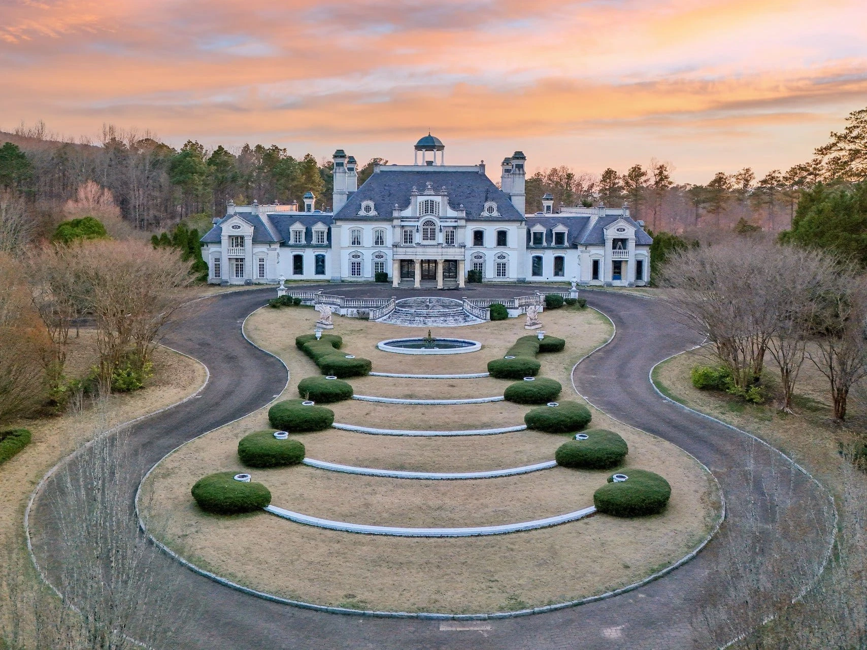 The largest home in Alabama, famous for its guitar-shaped driveway, is for sale. See inside the Versailles of Shoal Creek.