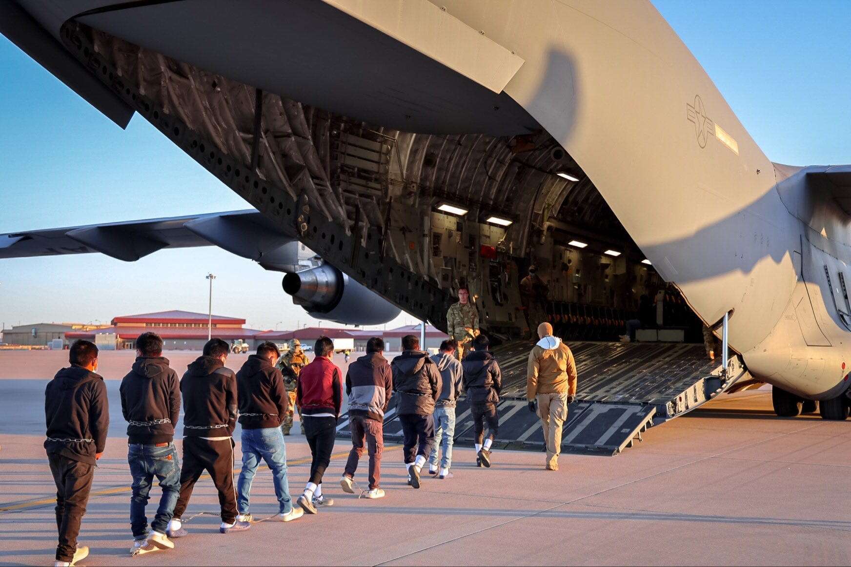 Trump's White House says deportation flights have started, posting pictures of people being loaded into US Air Force C-17s