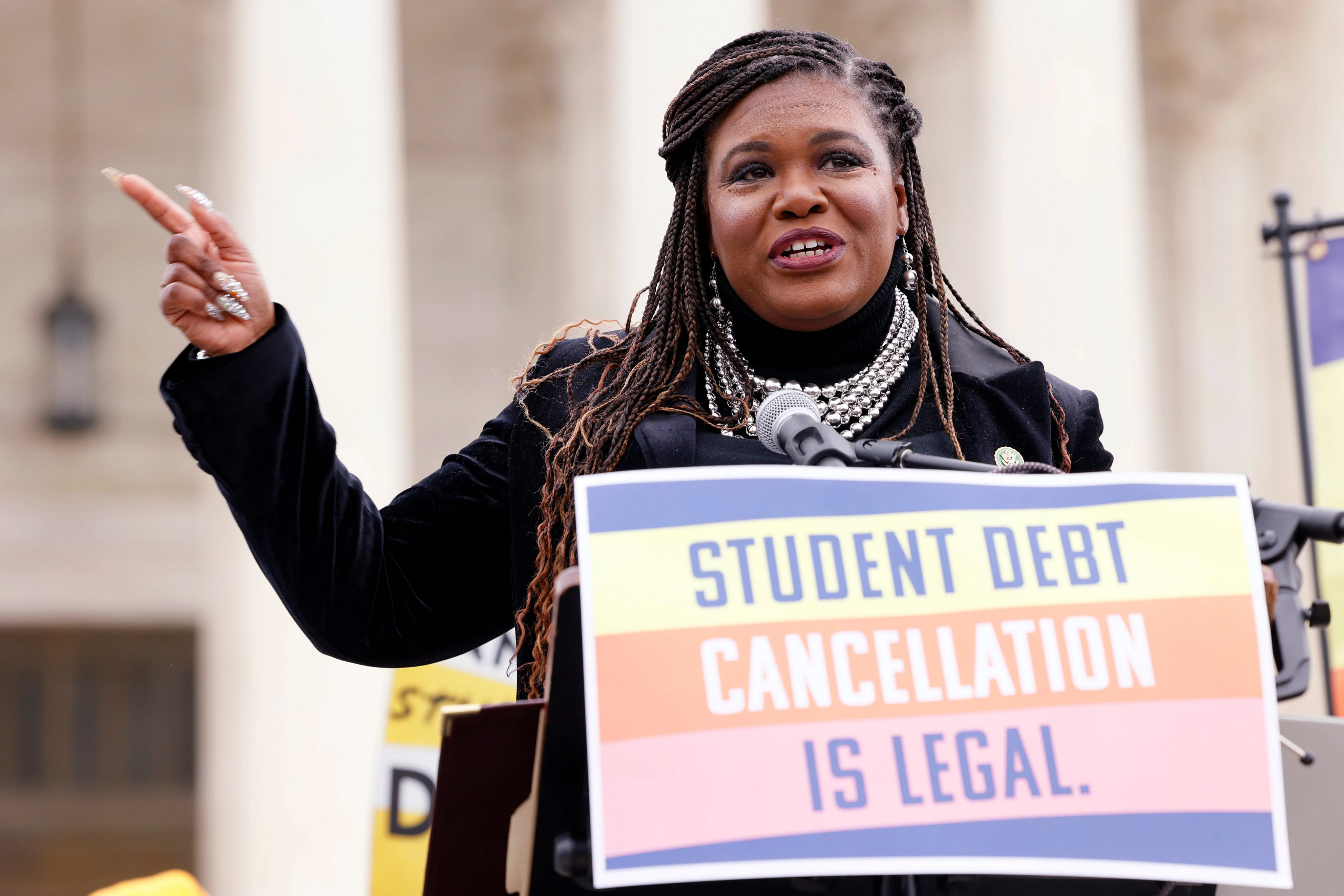 A major student-loan company owes debt of its own — but it's continuing to collect millions of borrowers' monthly bills. A Democratic lawmaker says it's time for it to pay up. 