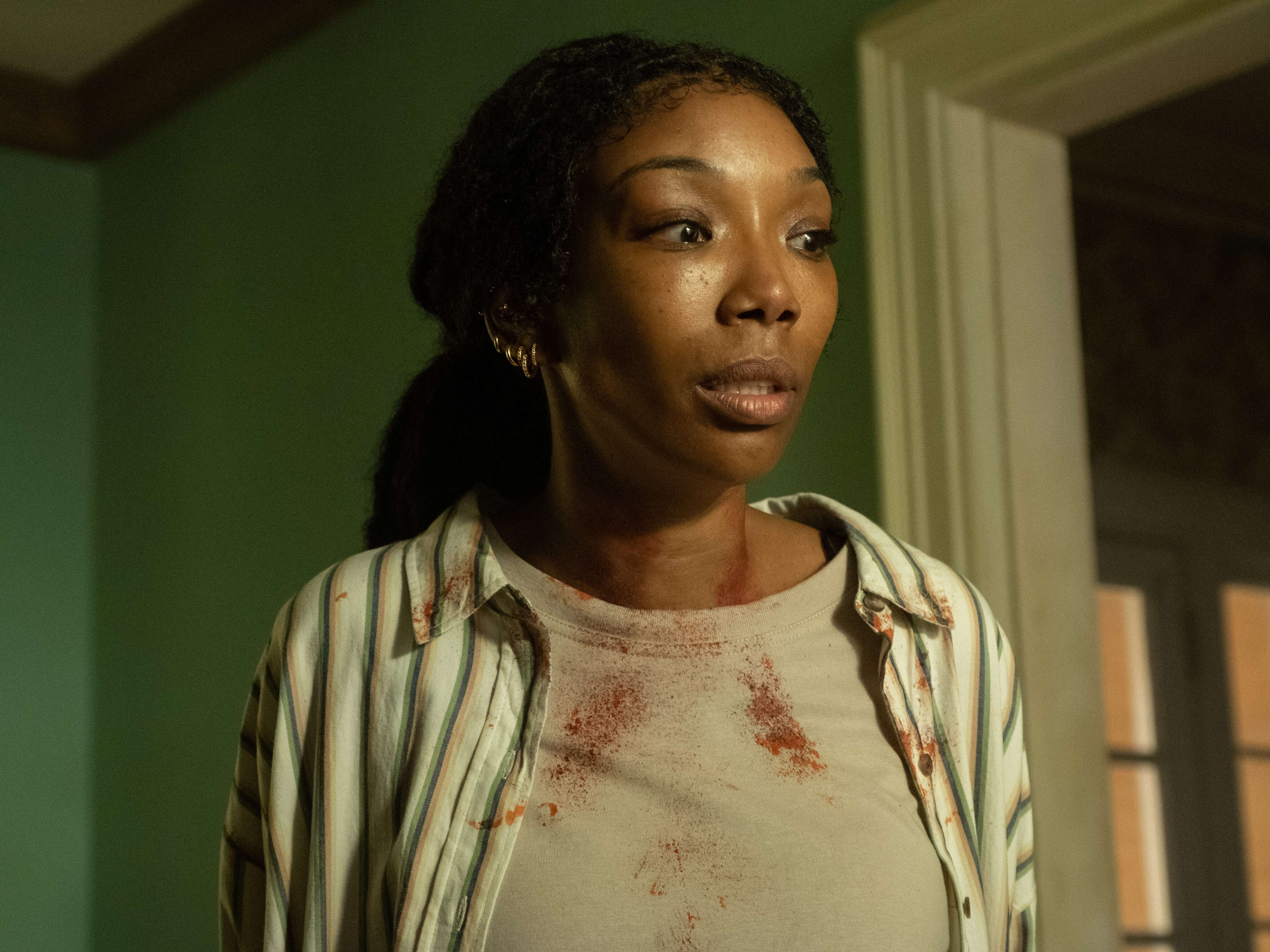 The shocking twist ending of Brandy's new A24 horror movie might not be what you think, says 'The Front Room' directors