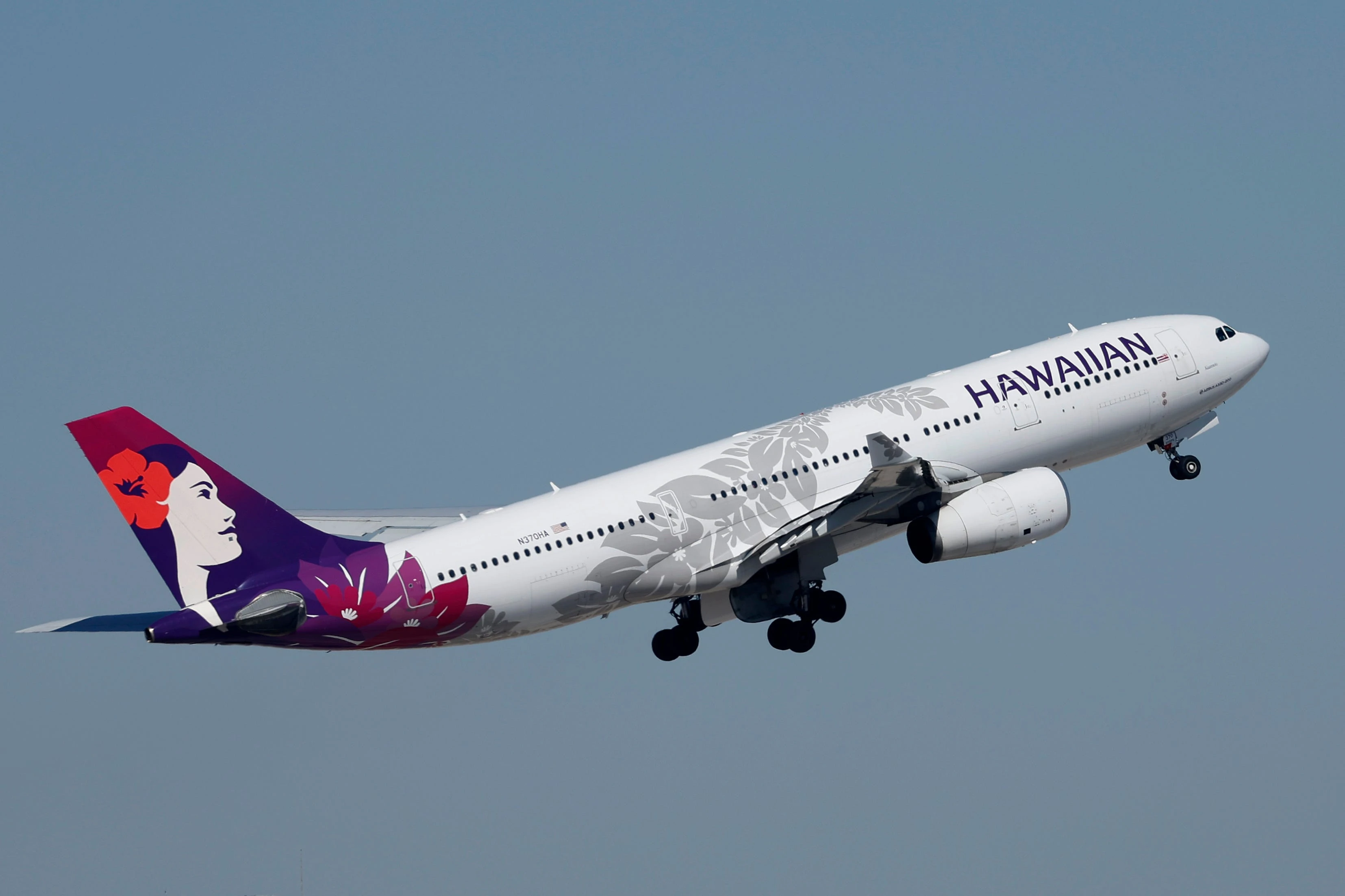 A Hawaiian Airlines flight declared an emergency after a passenger's phone got stuck in a seat and produced an 'electrical smell'