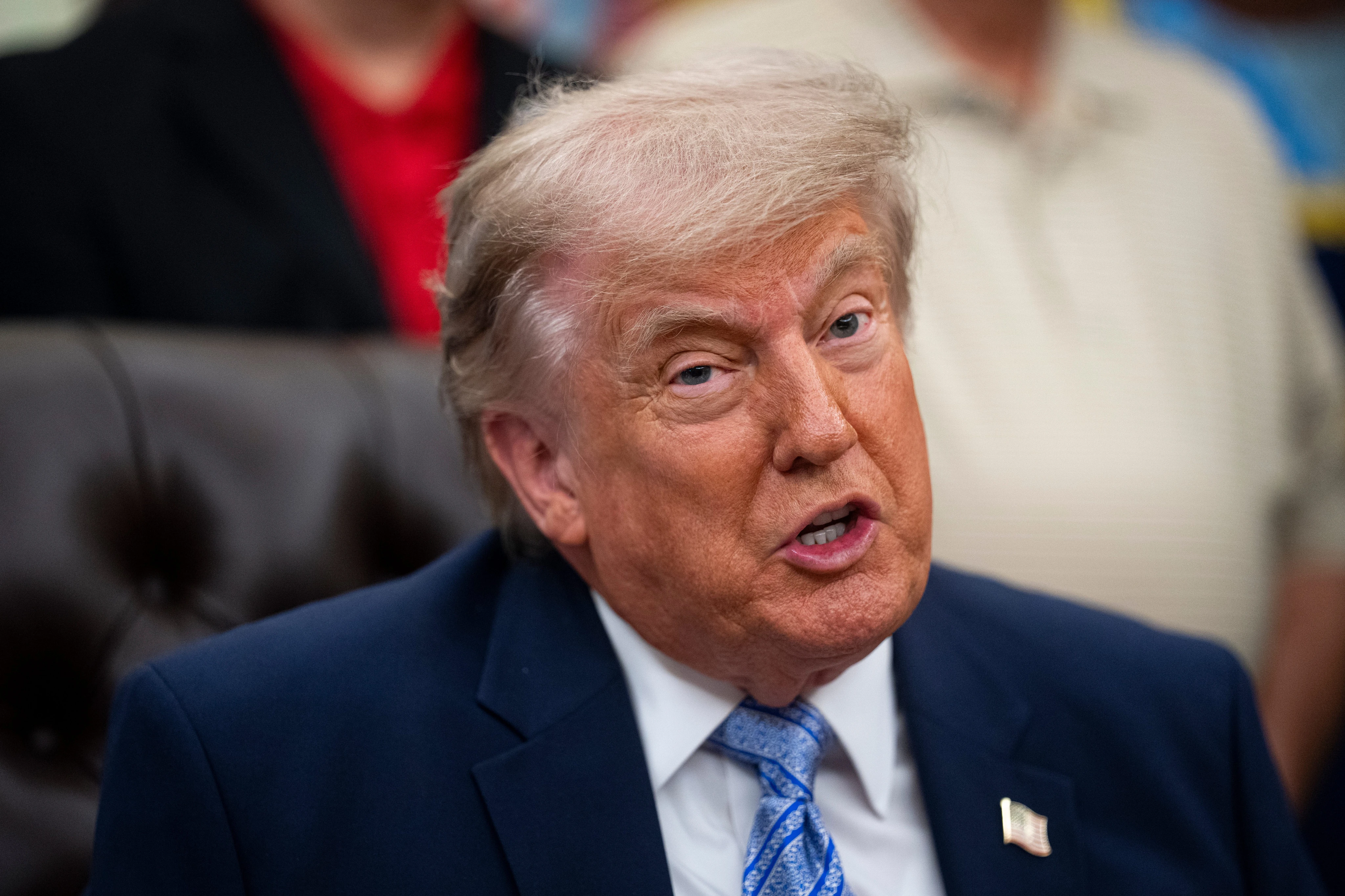 Trump privately signs scaled-back AI executive order that cuts down a voluntary review period