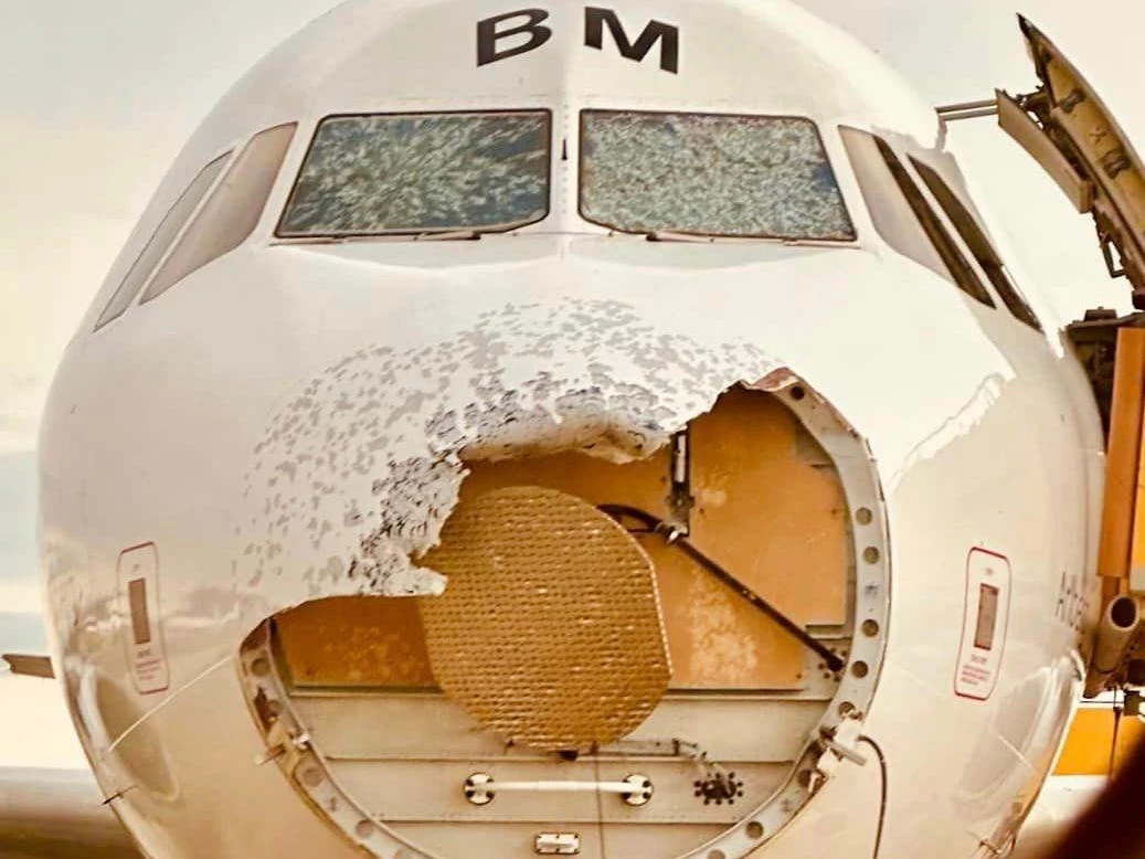 An Austrian Airlines plane had its windscreen shattered and nose cone torn off after flying through a thunderstorm 