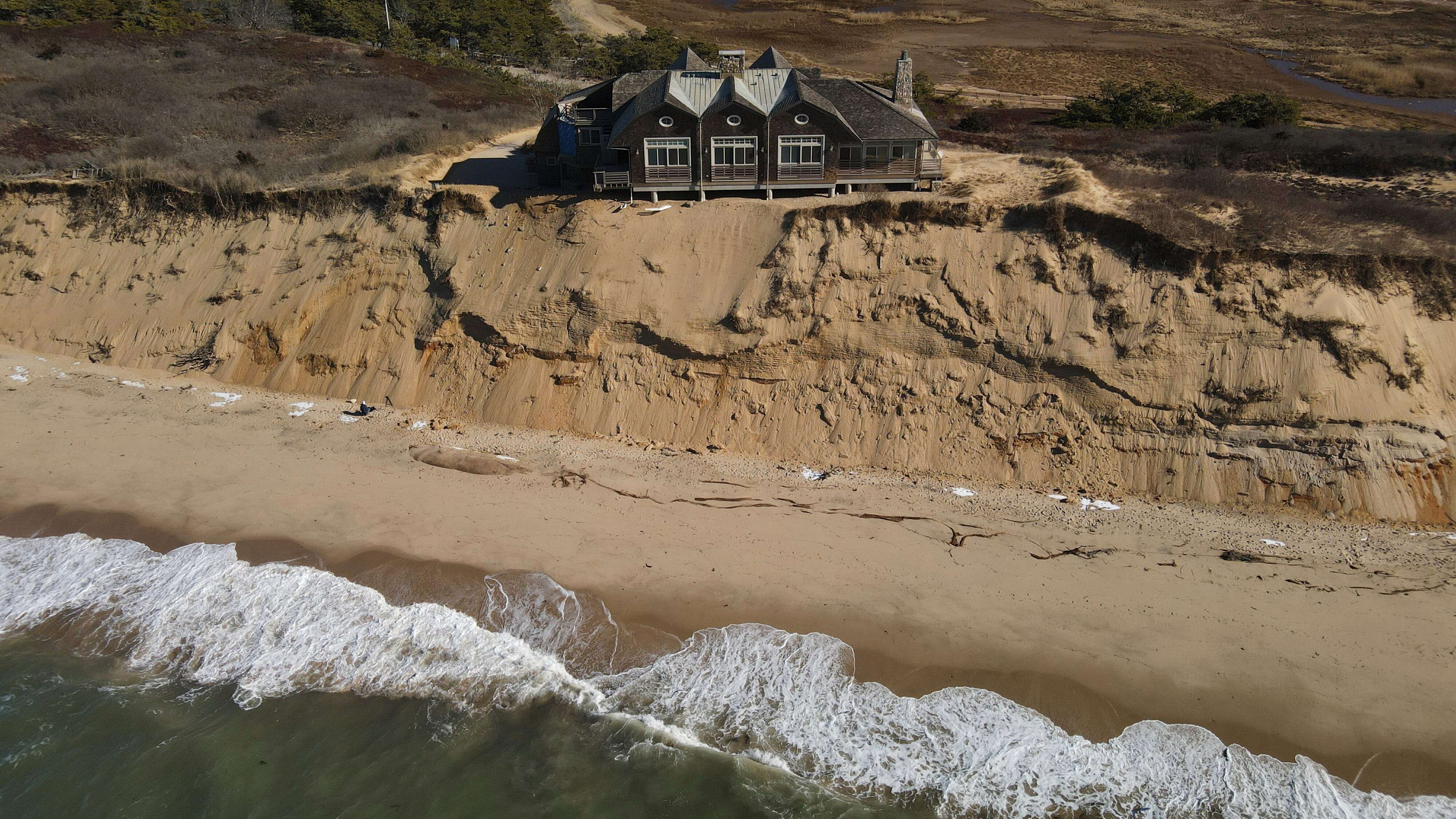 Another mansion is about to fall off a cliff into the sea. Here's why that keeps happening in tourist hot spots.