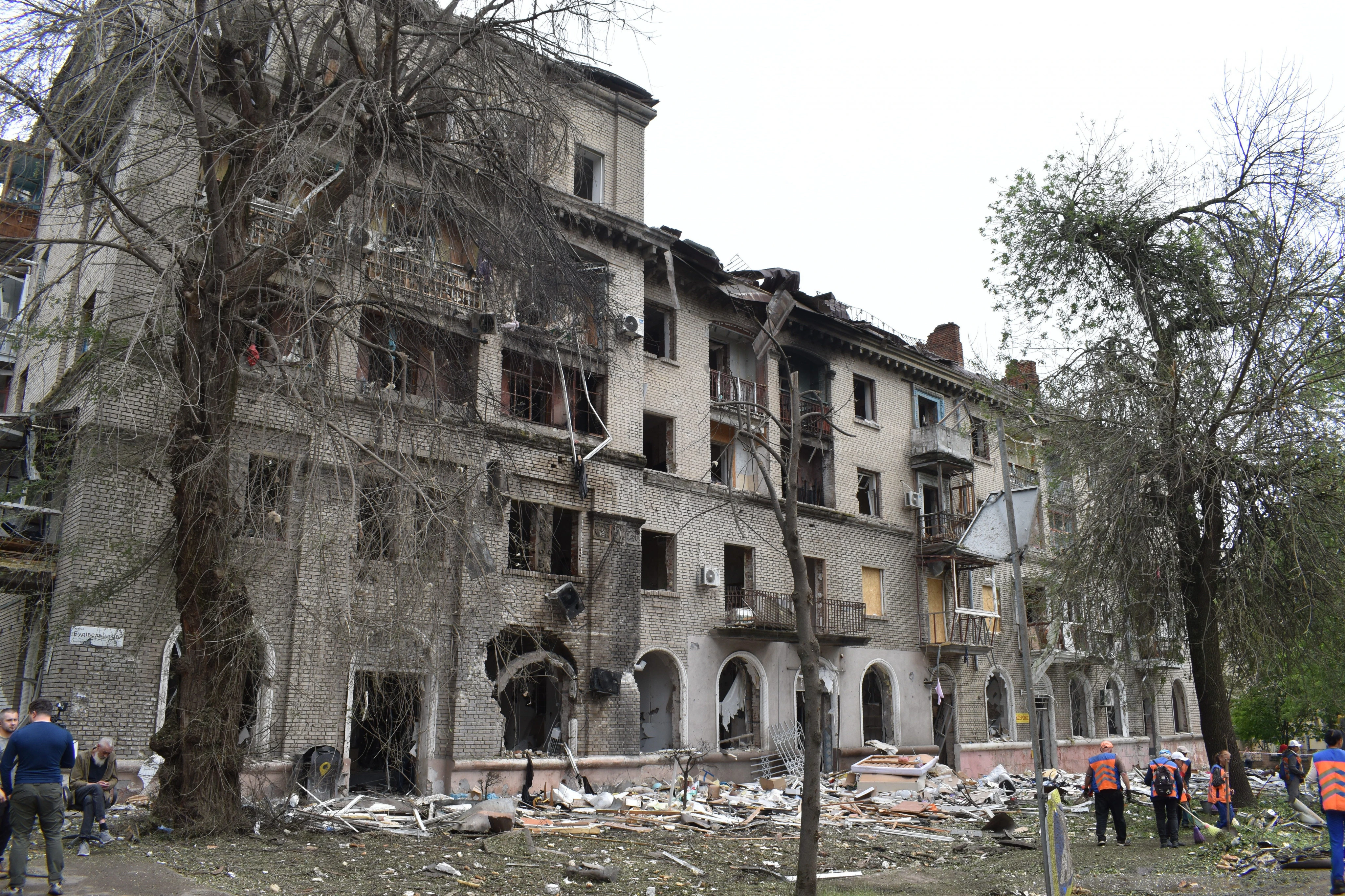 'Thank God I'm alive:' A Russian attack tore open this Ukrainian neighborhood, but residents quickly scrambled to pick up the pieces