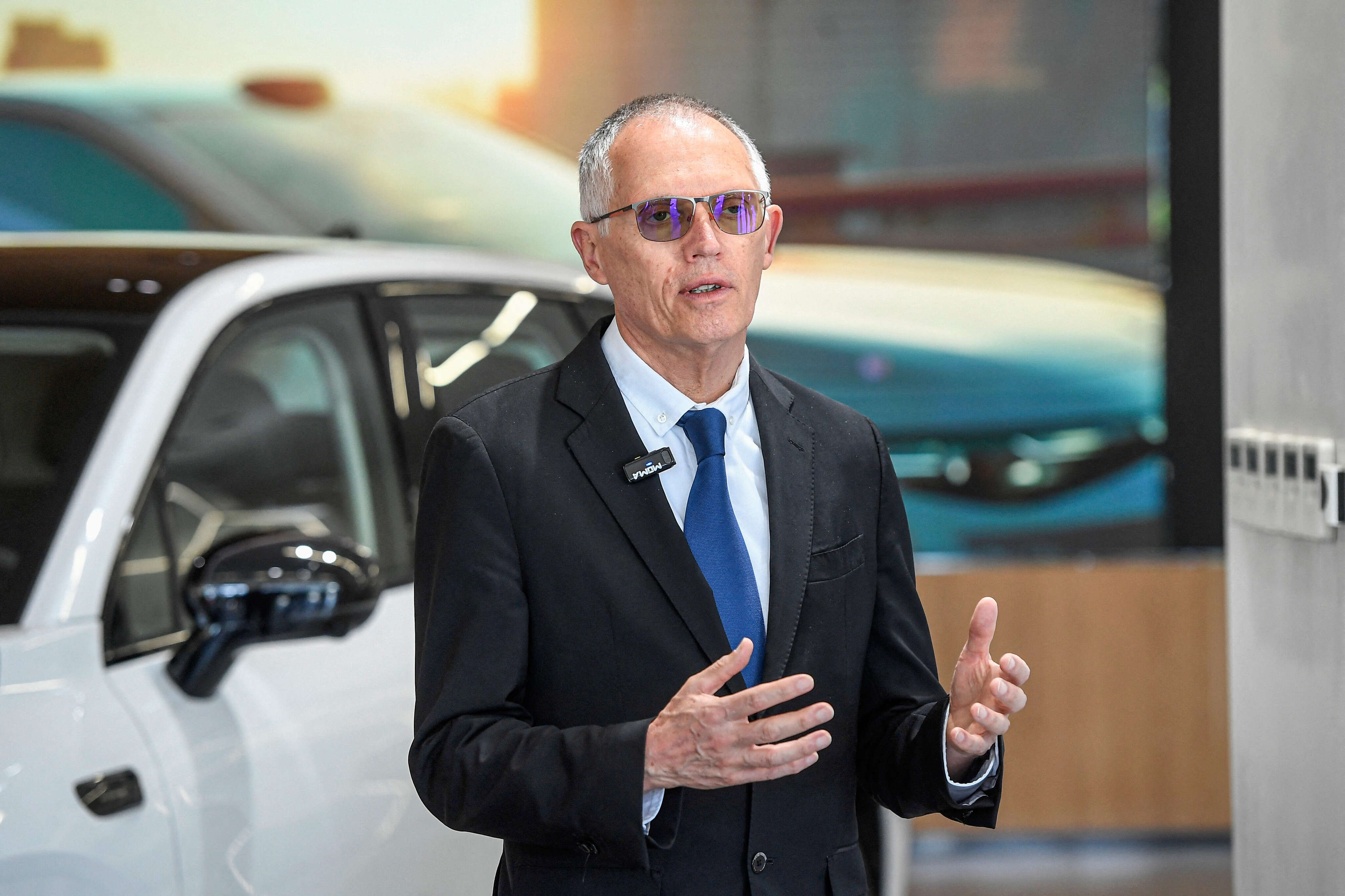 Automakers are headed for a 'big trap' if the industry doesn't swiftly enter the 'new world' of EVs, Stellantis CEO says