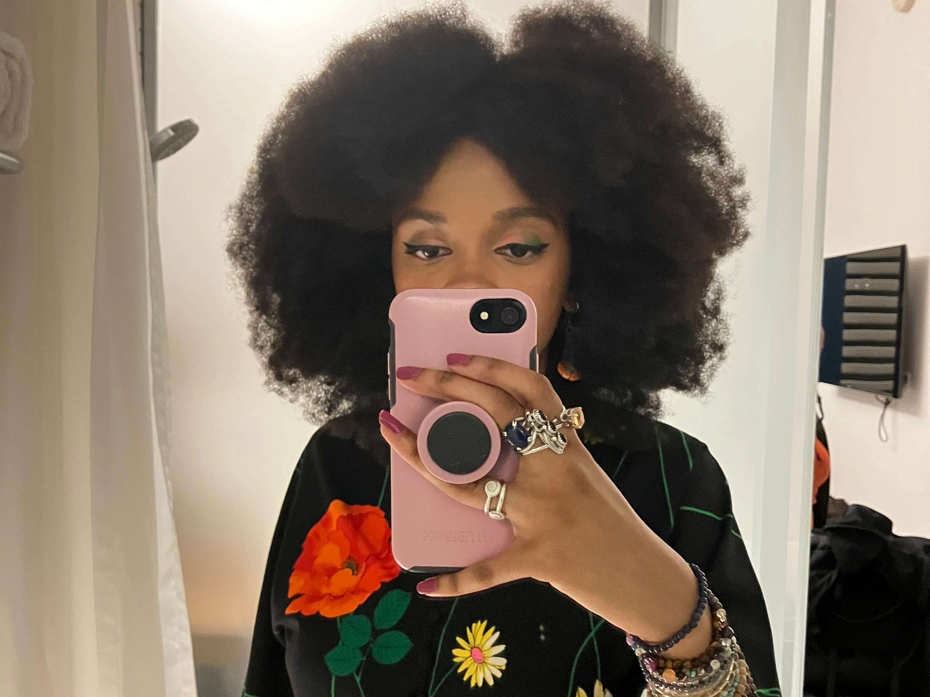 I wear bold outfits and my natural Afro to the office. People who say Gen Z can't dress for the workplace are wrong — we just do things differently.