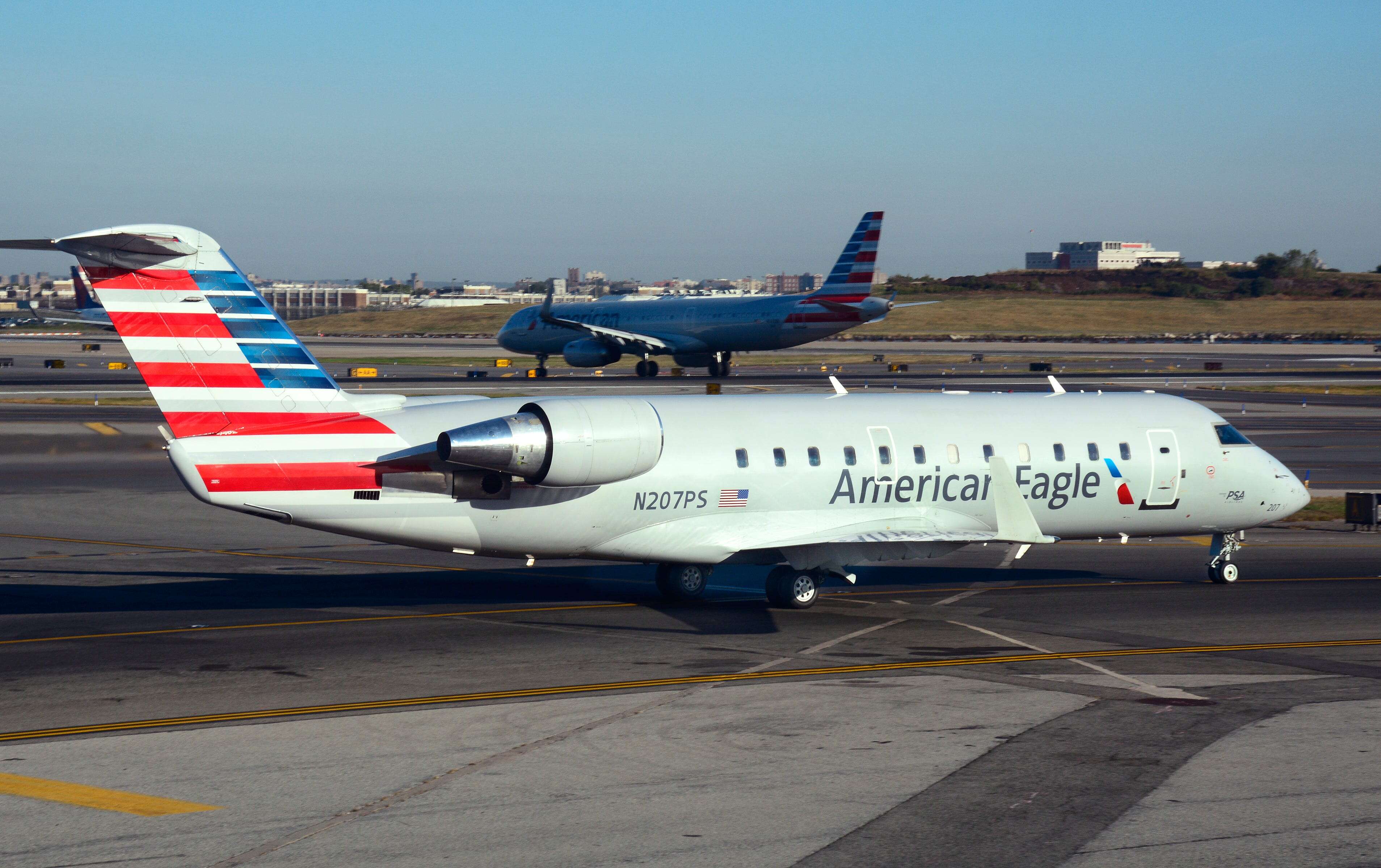 A United Airlines employee was severely injured after an American Eagle plane collided with a tug