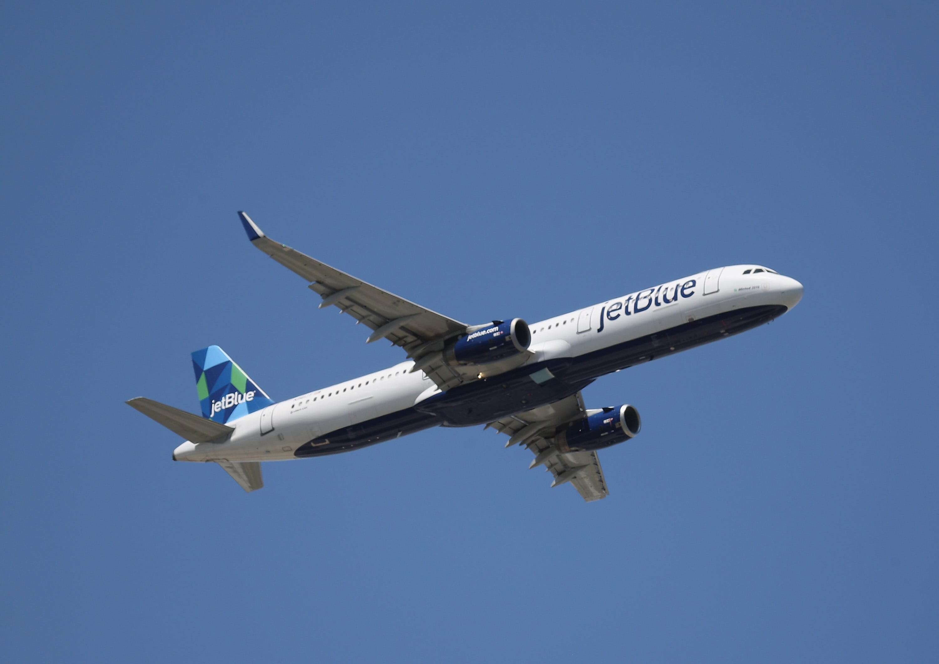 A block of ice fell from a JetBlue plane and crashed through a couple's bedroom ceiling, lawsuit says