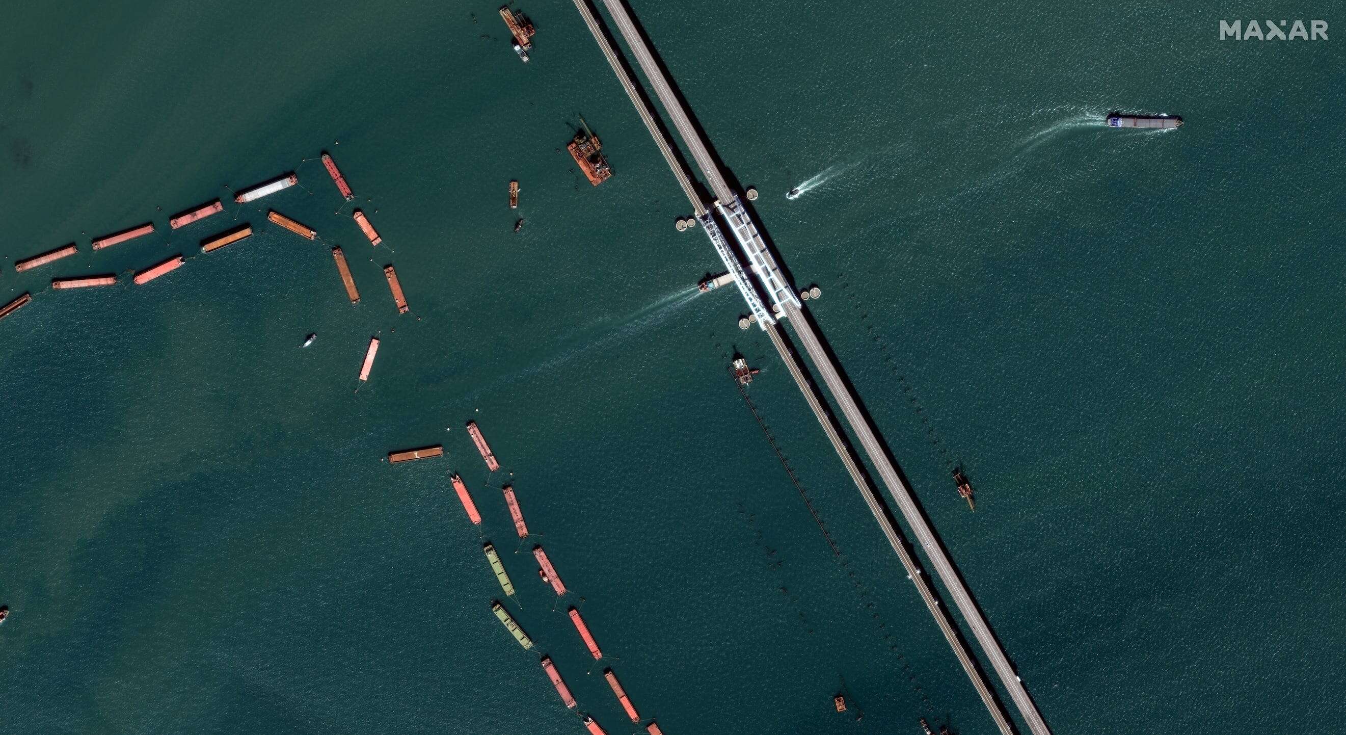 Satellite images capture Russia's scramble to shield a key bridge from Ukraine's exploding naval drones and other threats