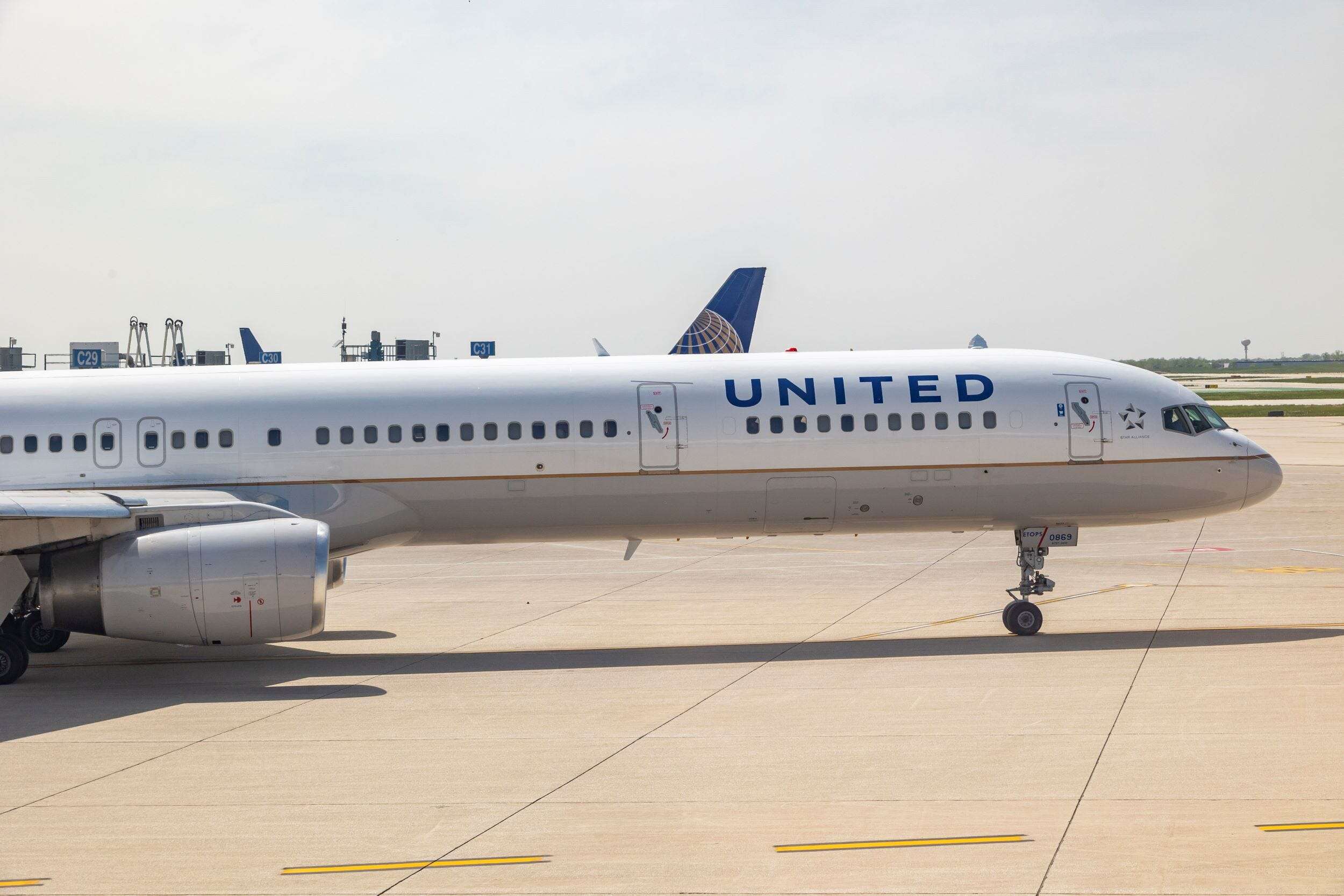 2 passengers were injured when United Airlines pilots responded to an inflight collision warning