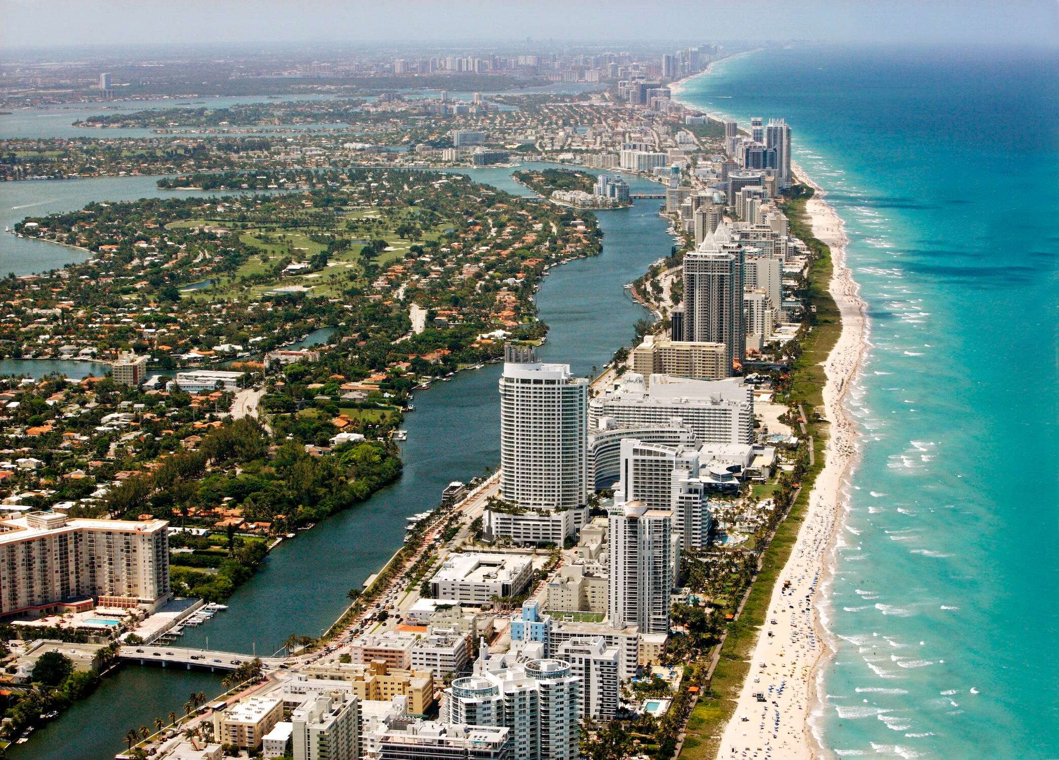 Miami's beachfront high-rises are sinking fast. It's a warning for coastal properties worldwide.