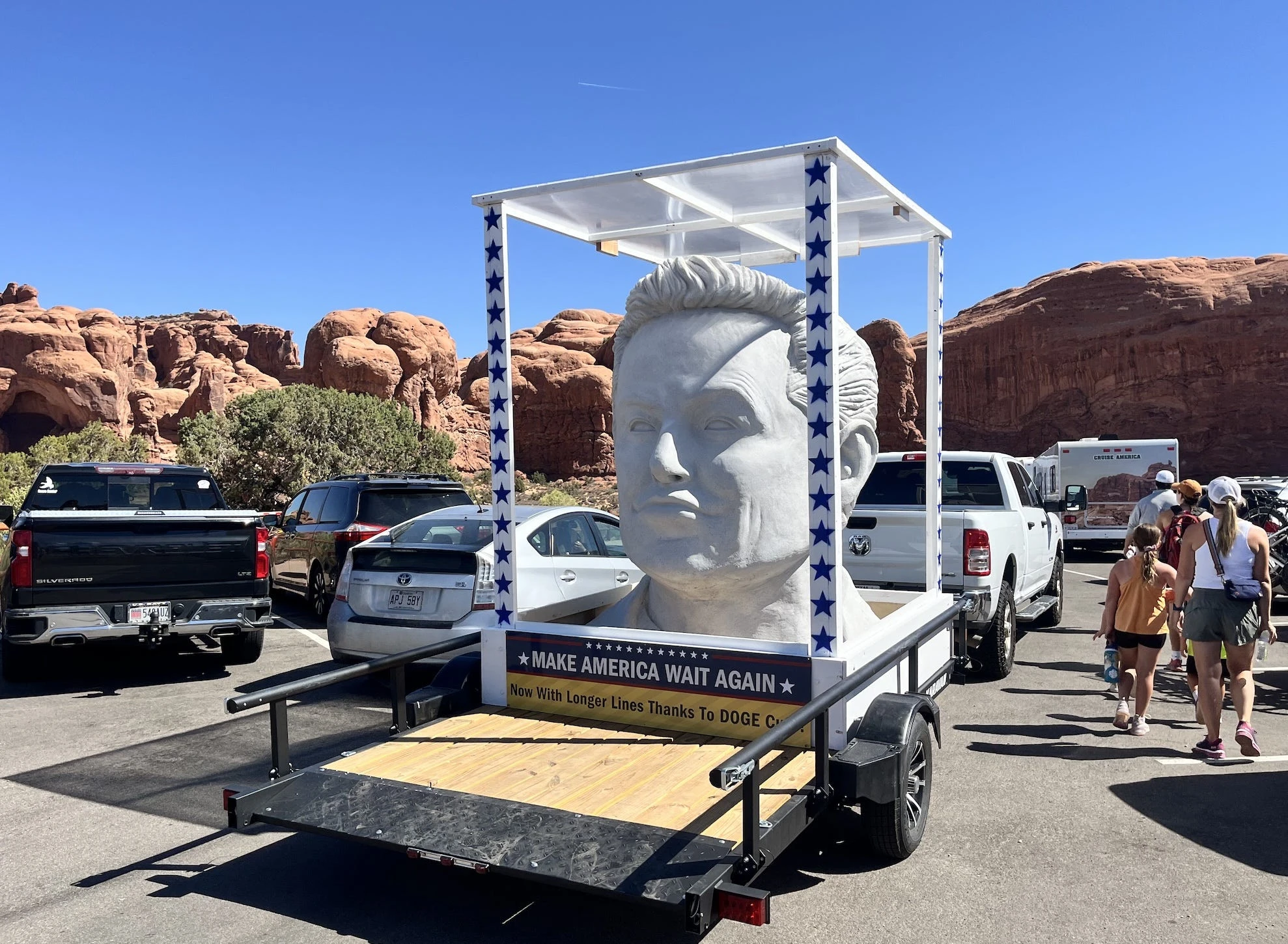 A giant Elon Musk bust was spotted at a Utah national park with a sign calling out DOGE cuts