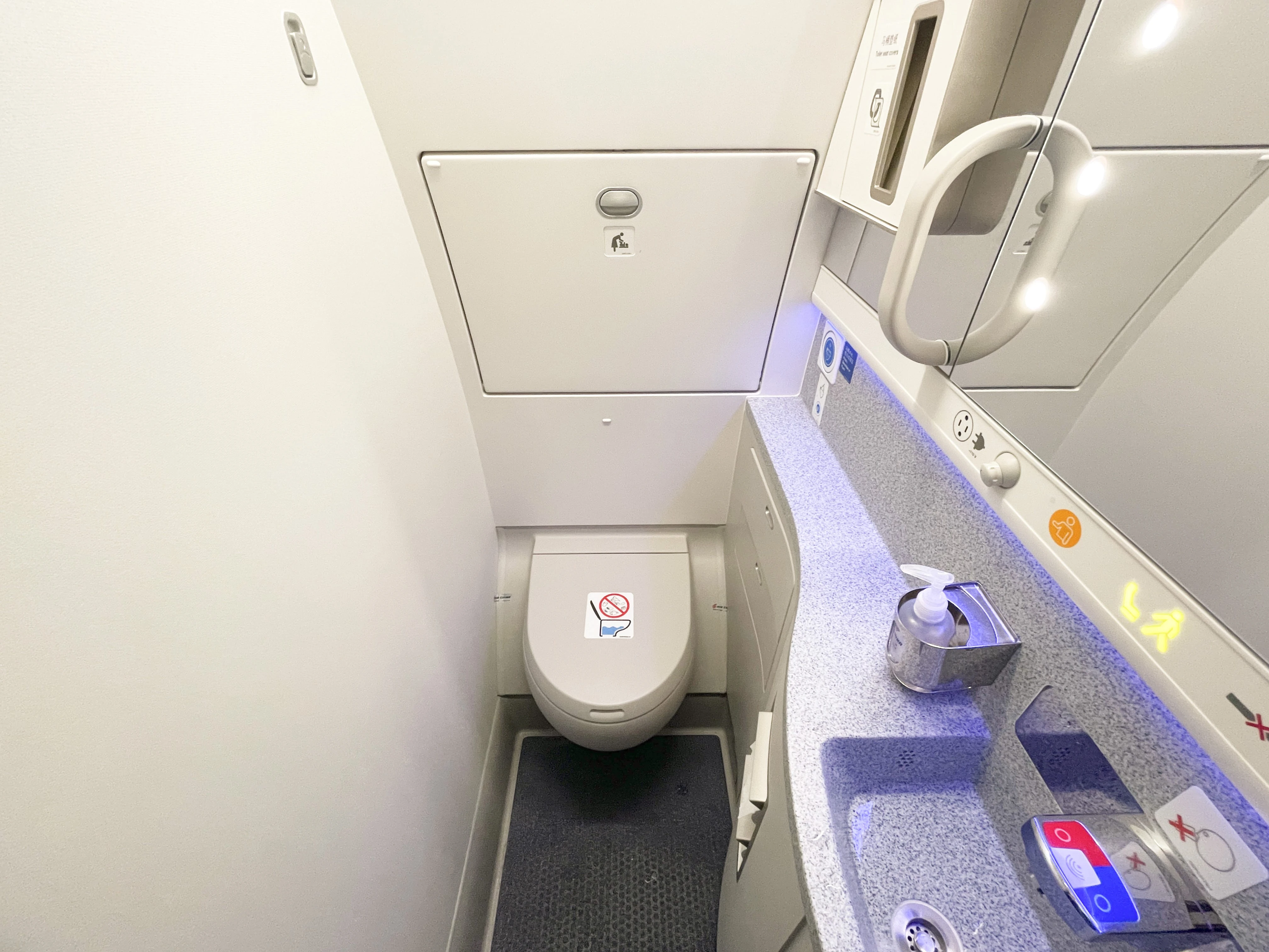 Passenger locked in a tiny plane bathroom claims he was tossed around and suffered injuries as it landed, report says