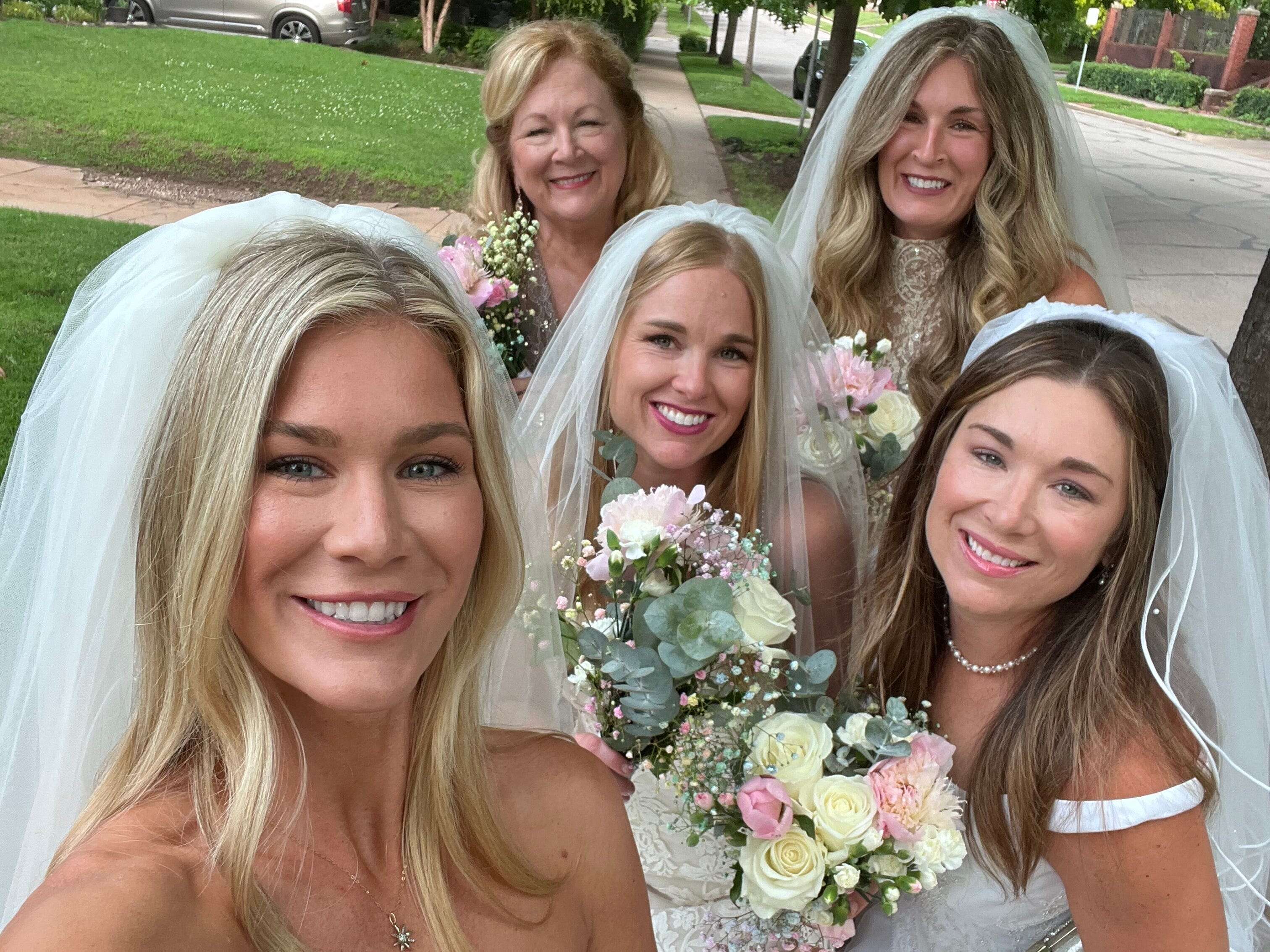 I had my mom and sisters wear their wedding dresses for my 40th birthday. People stopped to take photos of us.