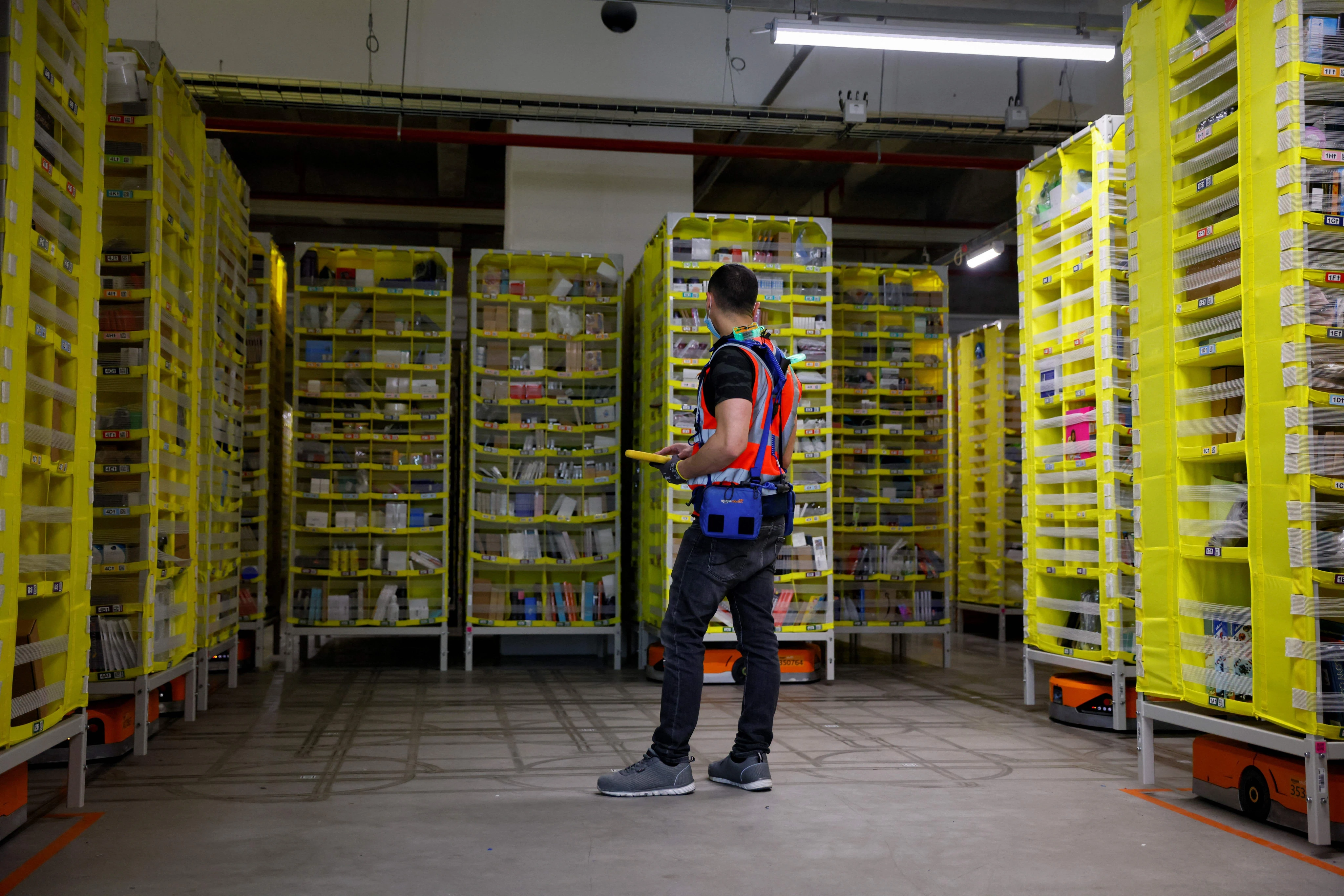 Amazon is on a mission to optimize warehouse work. Its latest test puts wearable devices on support staff.