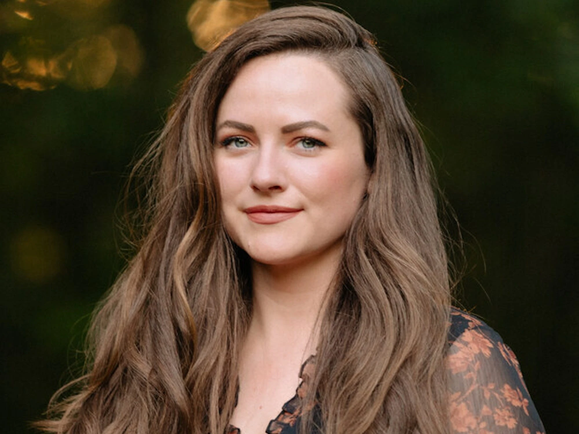 'Divine Rivals' author Rebecca Ross shares how she went from working a 9-to-5 to publishing one of BookTok's favorite series