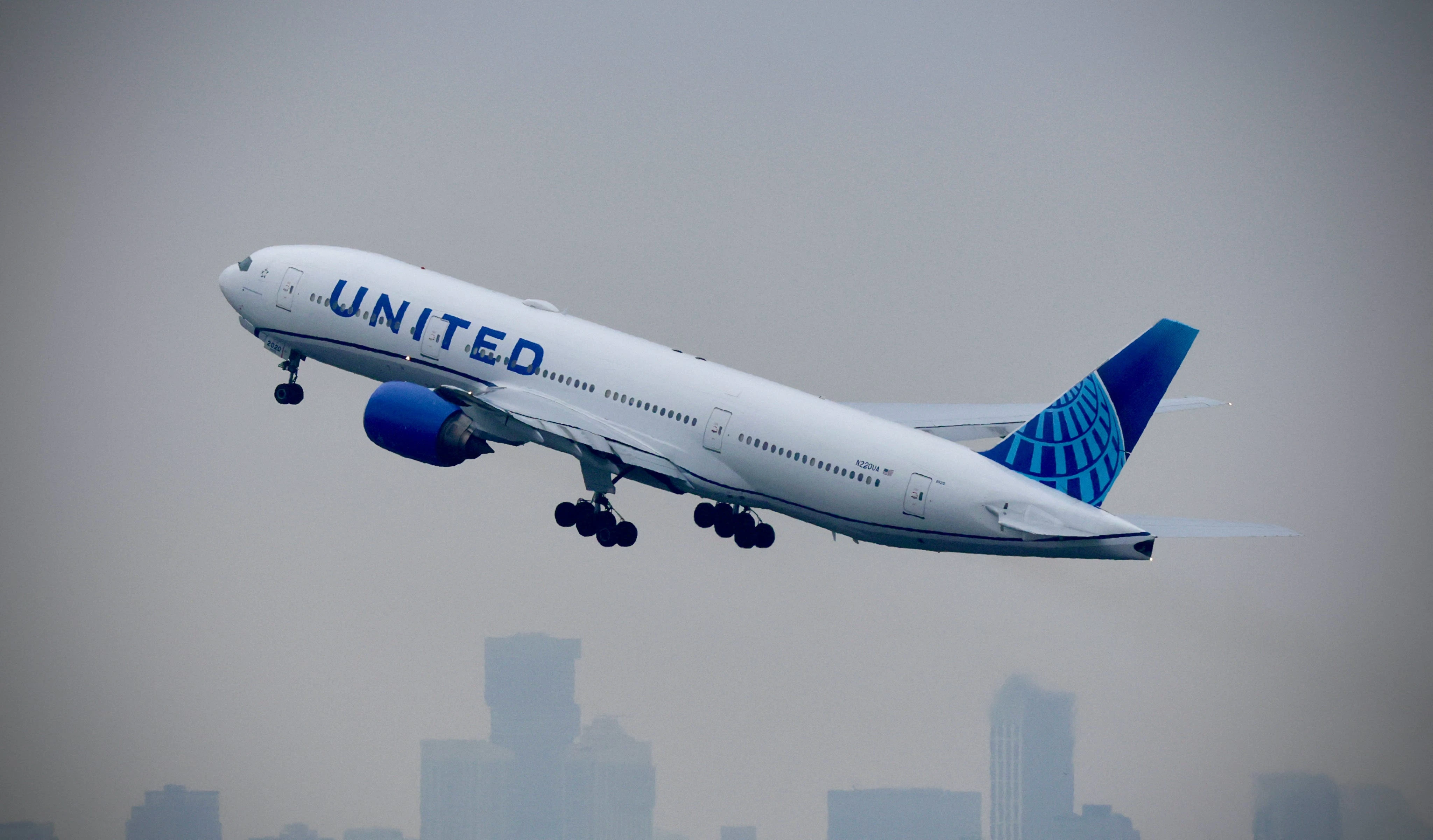 Passenger injured by falling suitcase sues United, saying cabin crew should've helped put luggage in overhead bin
