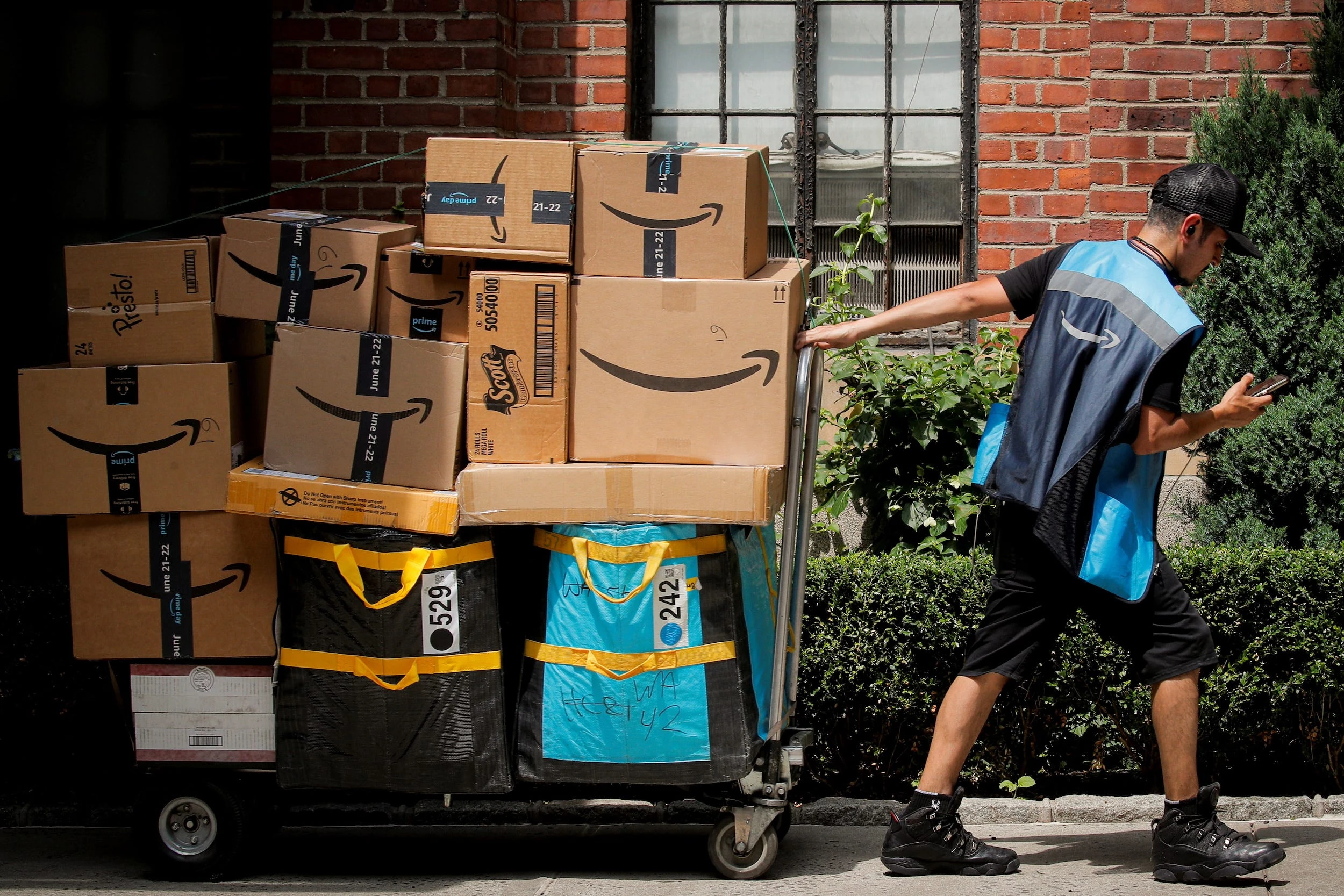 Amazon's CEO sees evidence of people stockpiling — and says that sellers will likely pass tariff costs onto shoppers