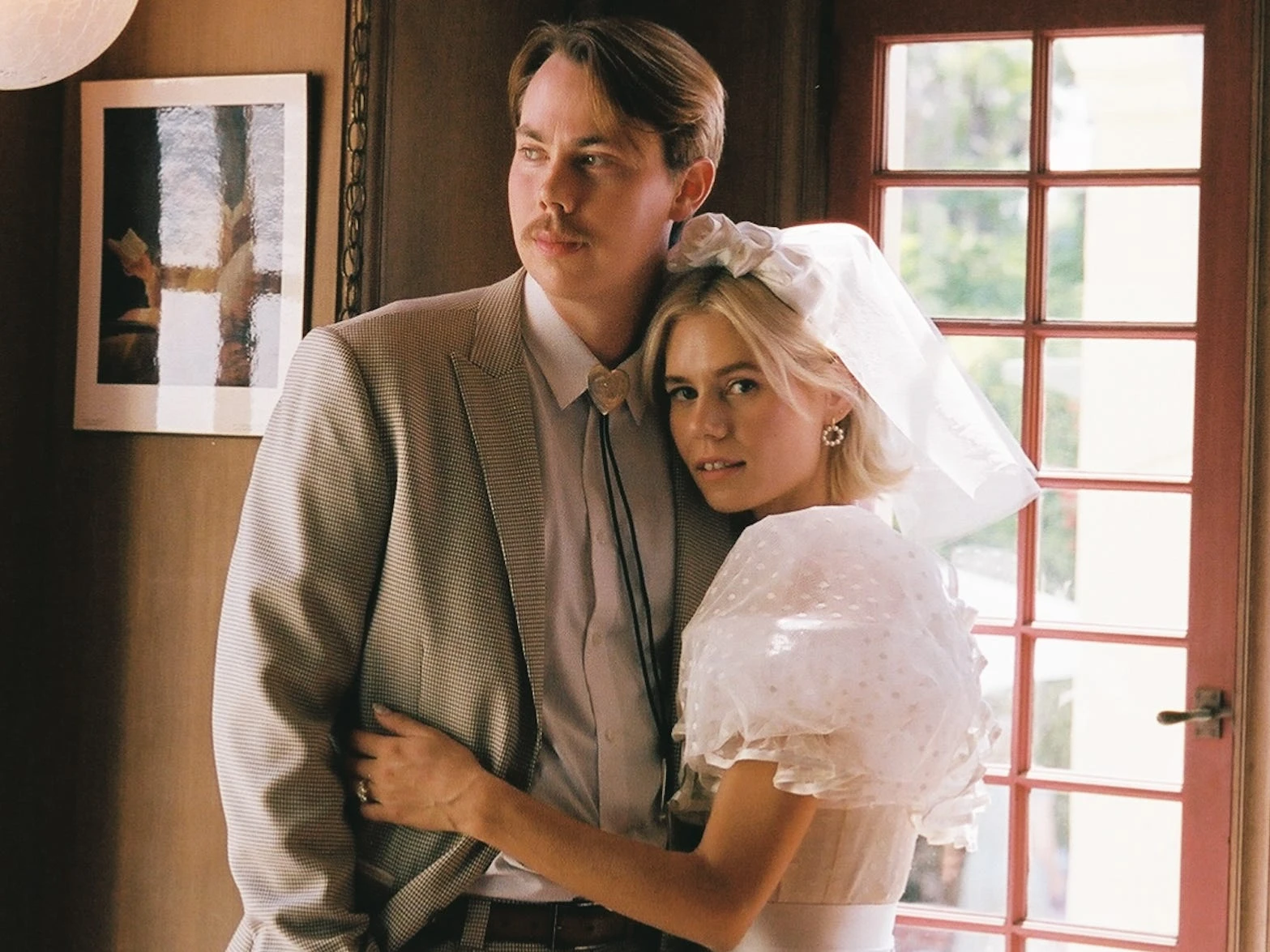 A couple pulled off their dream wedding with 125 guests for under $25,000. From Costco cake to thrifted decor, here's how they did it.