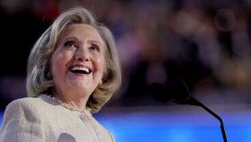 DNC Crowd's 3-Word Chant About Trump Makes Hillary Clinton Smile During Speech