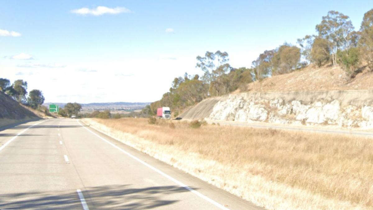 Man dead, another trapped in wreckage as two trucks crash on NSW highway