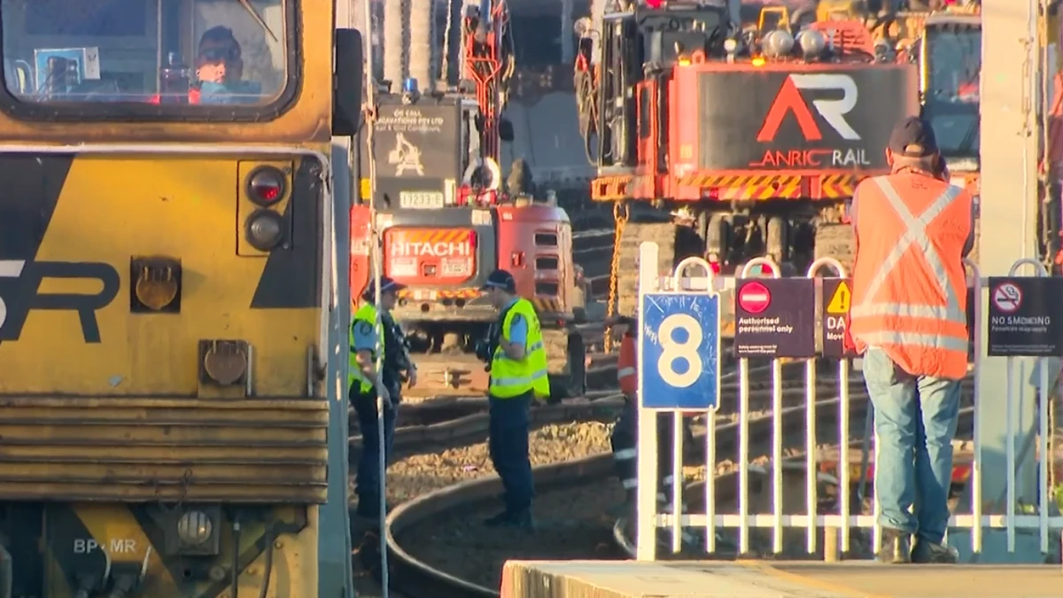 Rail worker trapped in machine at busy train station
