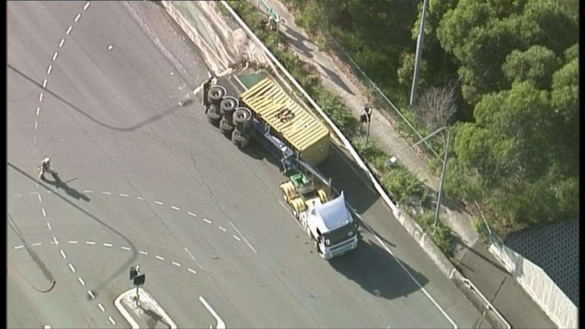 Traffic chaos near Brisbane following rollover of truck carrying dangerous chemicals