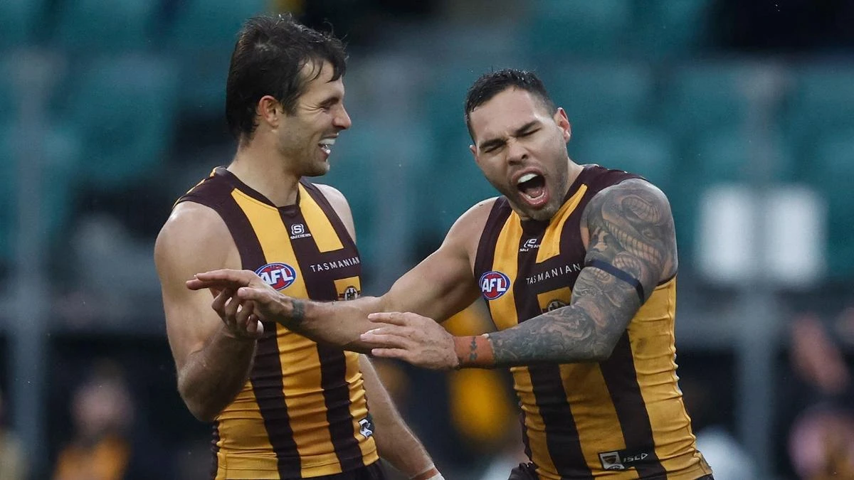 Hawks midfielder airlifted to hospital for emergency surgery