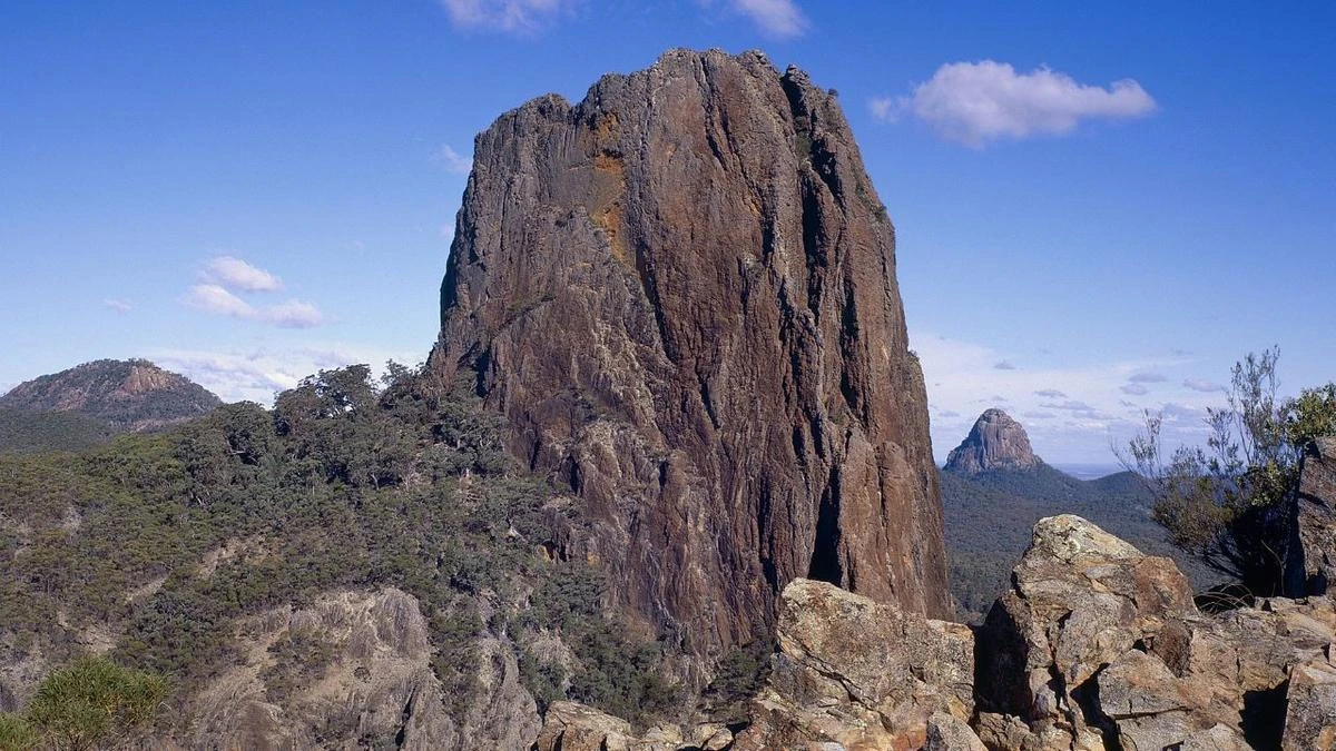 Climber concussed by falling rock stranded on 150m-high ledge