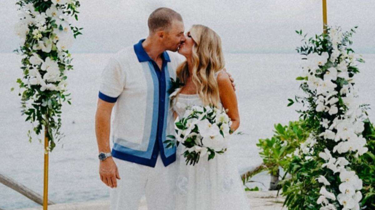 AFL coach and partner marry in tropical paradise