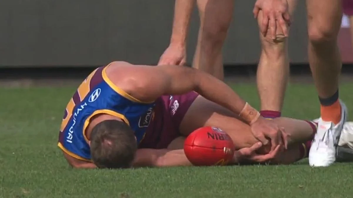 Crowd falls silent as respected defender goes down in pain