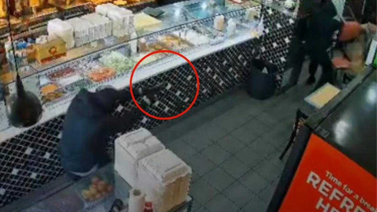 Chilling moment masked men storm kebab shop and open fire