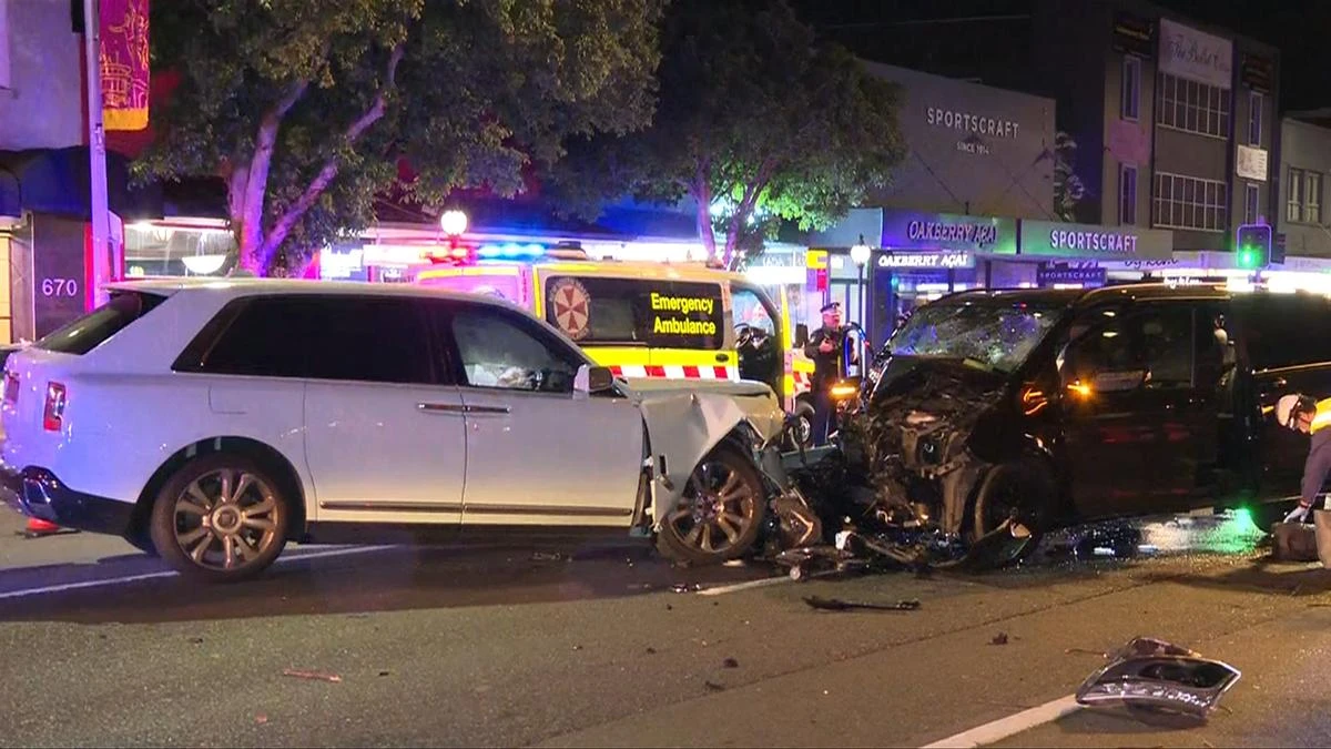 Rolls-Royce and Mercedes smash head-on in affluent suburb