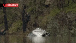 Tragic scenes as ute where father and son died in river crash dredged from river
