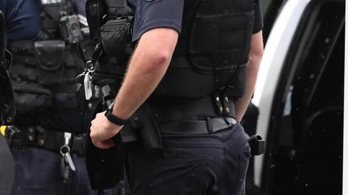 Top cop charged after allegedly stalking and intimidating woman at work
