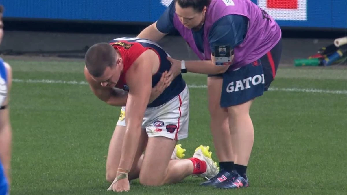 Ambulance called as concerns grow for injured defender