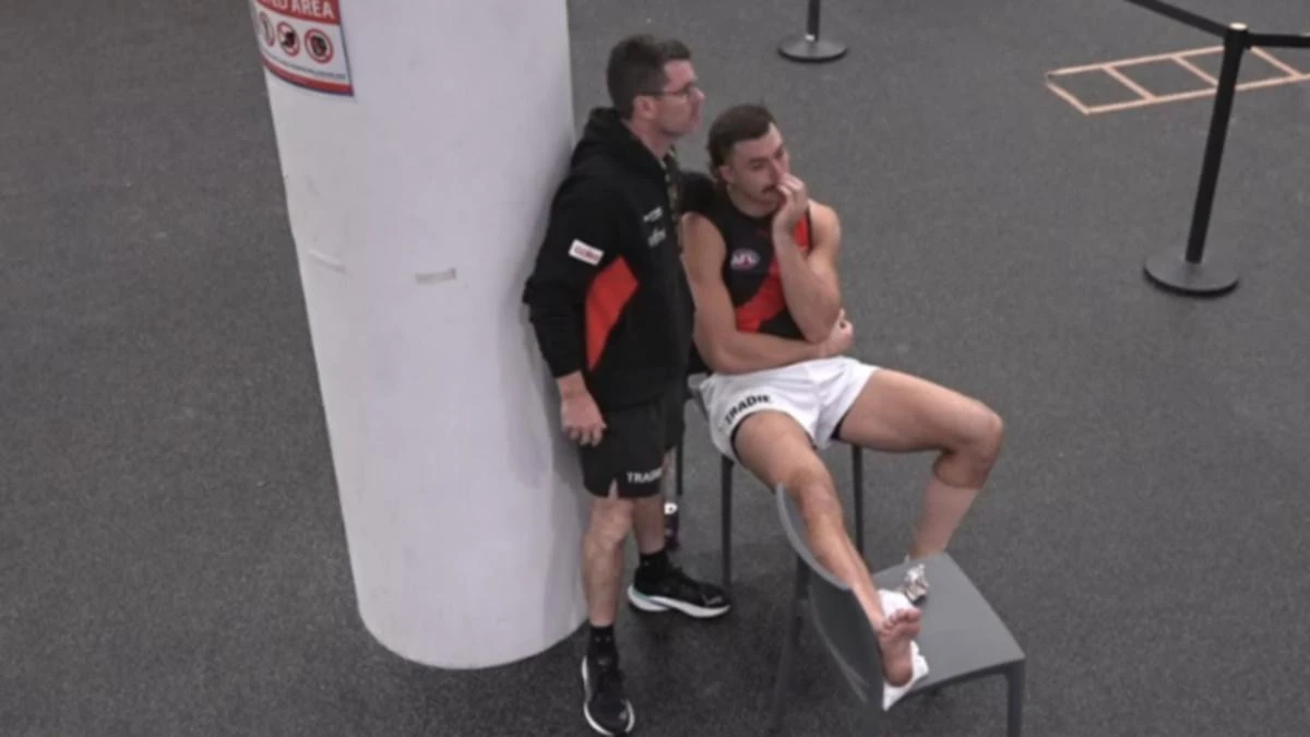 Essendon fan favourite consoled in tears after innocuous incident
