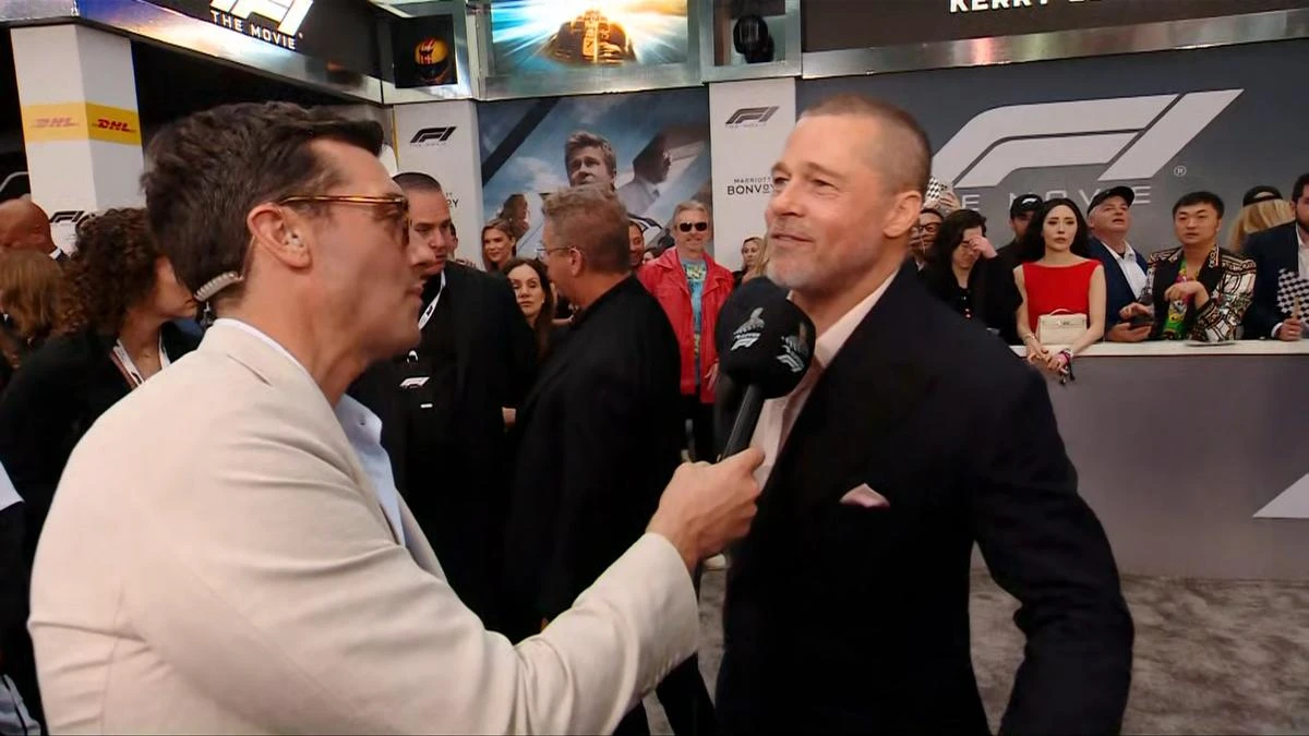 Brad Pitt reveals reason for his new buzzcut as he chats to David Woiwod on the red carpet