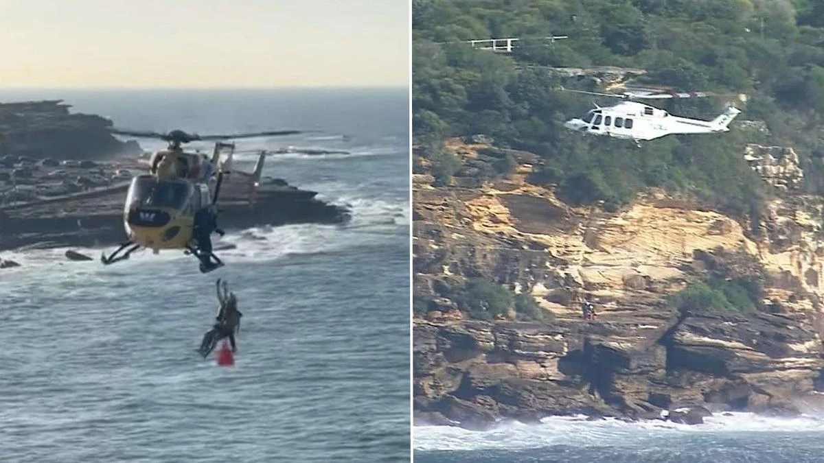 Warning as two swimmers winched from rocks at popular beach
