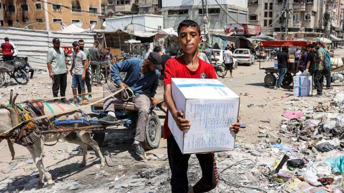 Israel passes laws restricting UN agency aid in Gaza where thousands are already starving